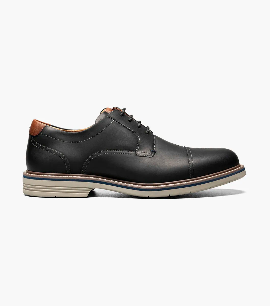 Black leather dress shoe on a white background