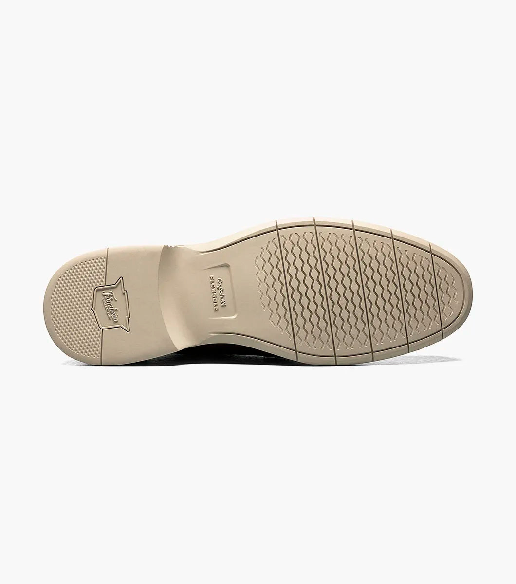 Close-up of a shoe sole with brand logo on a white background