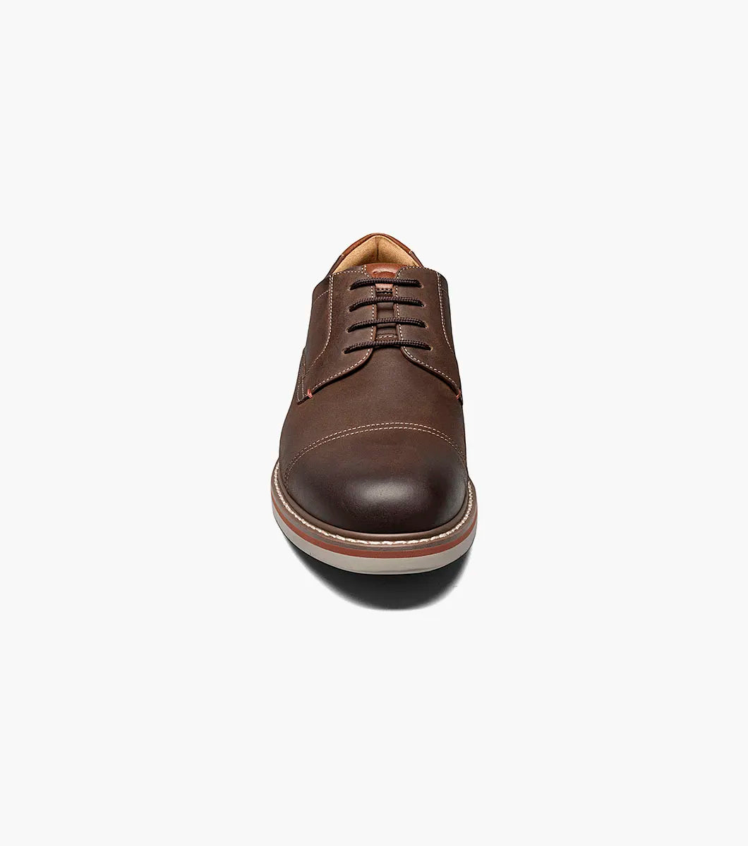 Brown leather shoe on a white background