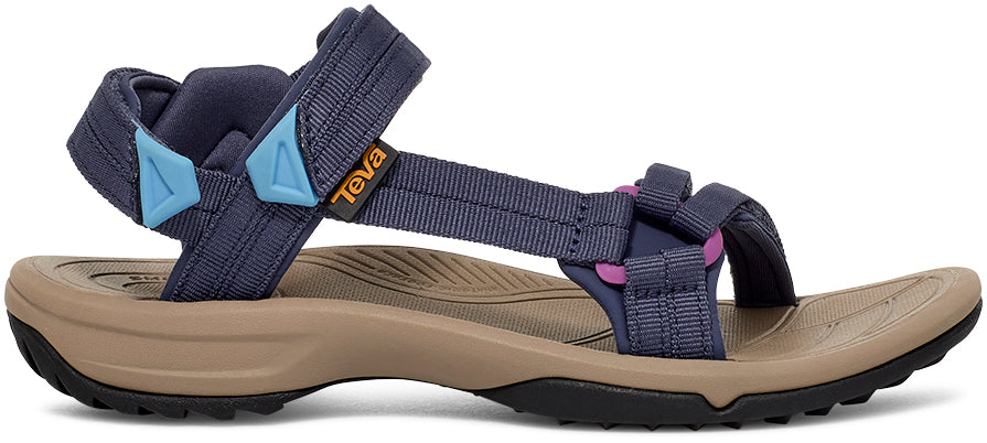 Navy and beige sandal with Teva logo on a white background