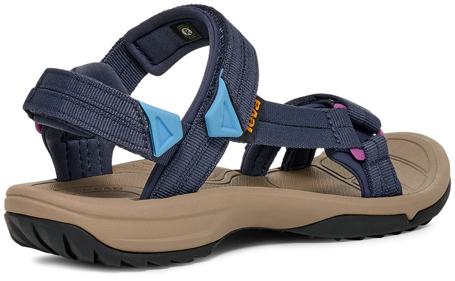 Navy blue sandal with beige sole on a white background