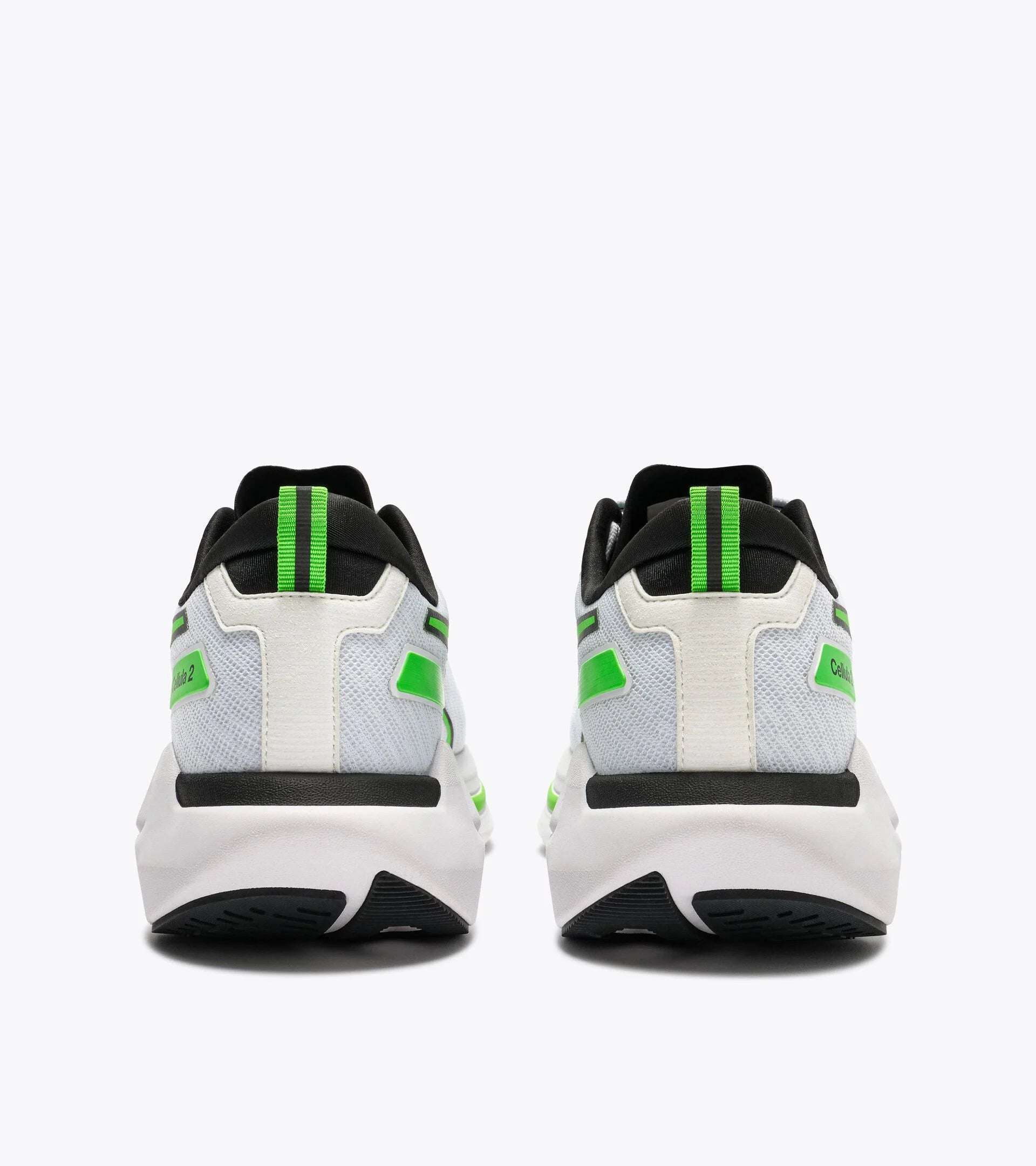 White sneakers with green accents on a white background