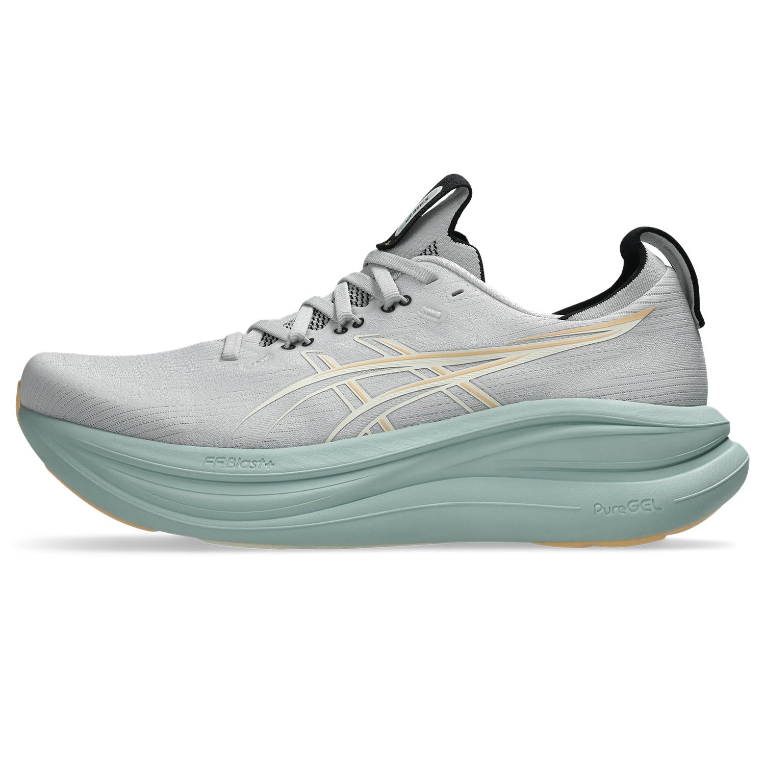 Gray running shoe with green sole on a white background
