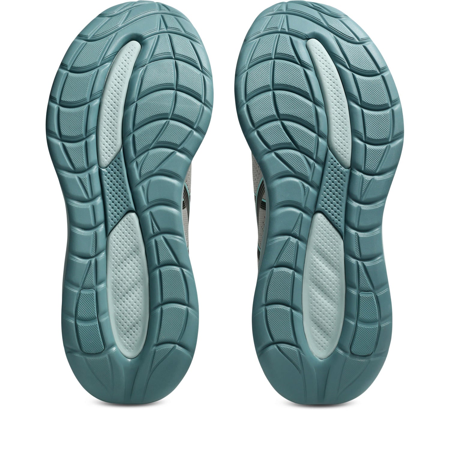 Teal and gray shoe soles on a white background