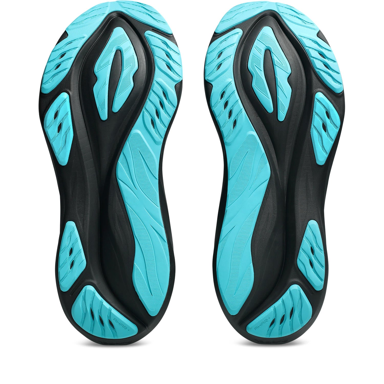 Black and turquoise shoe soles on a white background