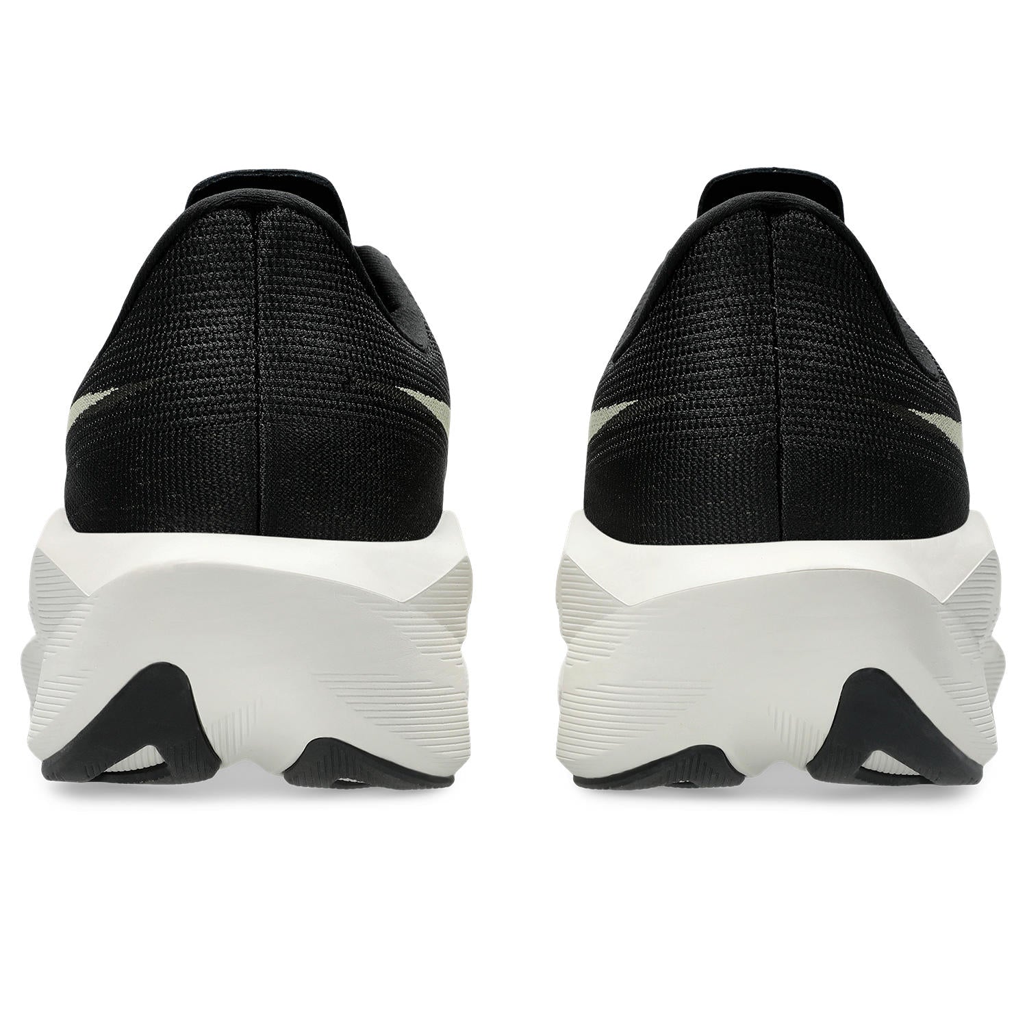 Black athletic shoes with white soles on a white background