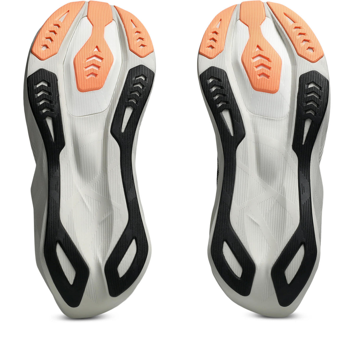 A pair of athletic shoe soles shown from the bottom, featuring a white and gray base with black sculpted side supports and bright orange protective toe sections.