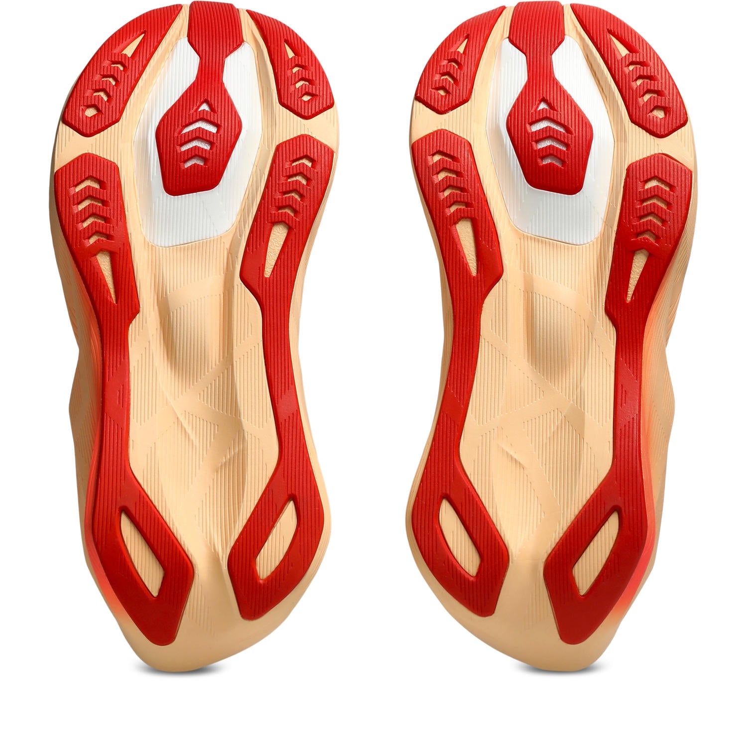 Top view of red and beige shoe insoles on a white background