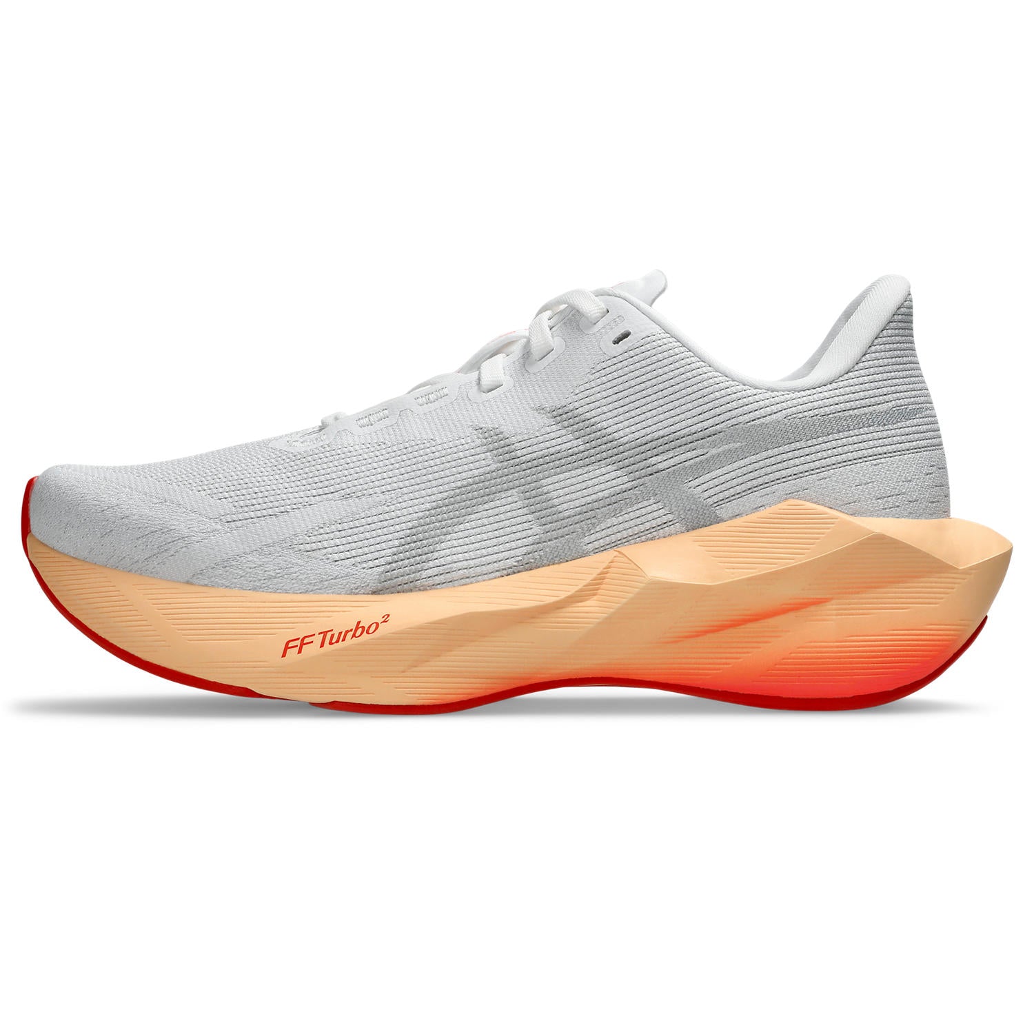White running shoe with orange sole on a white background
