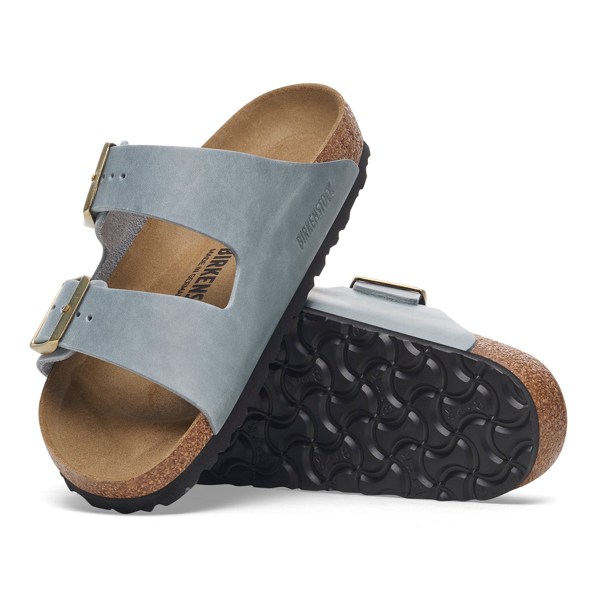 Pair of Birkenstock sandals with gray upper and brown sole on a white background