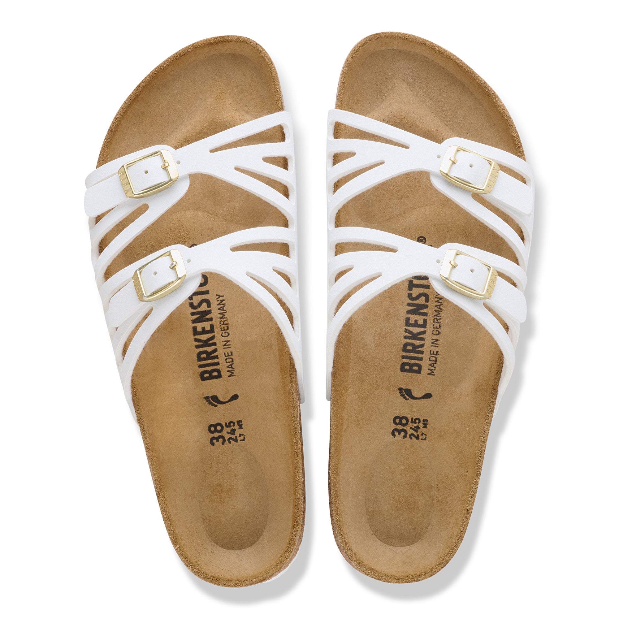 White sandals with brown soles and Birkenstock branding on a white background
