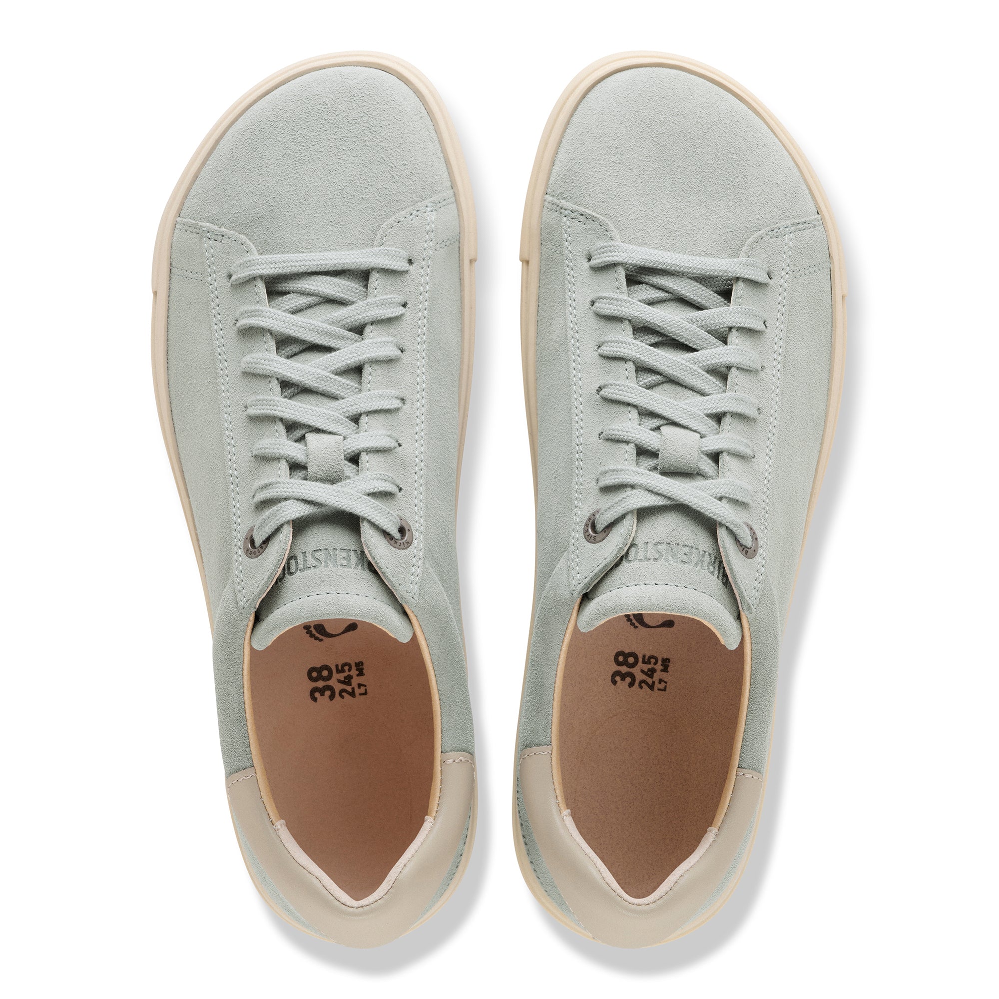 Pair of light gray sneakers with visible brand name on a white background