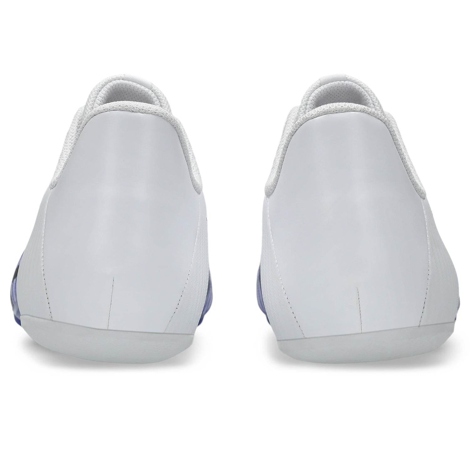 White slip-on shoes with blue accents on a white background