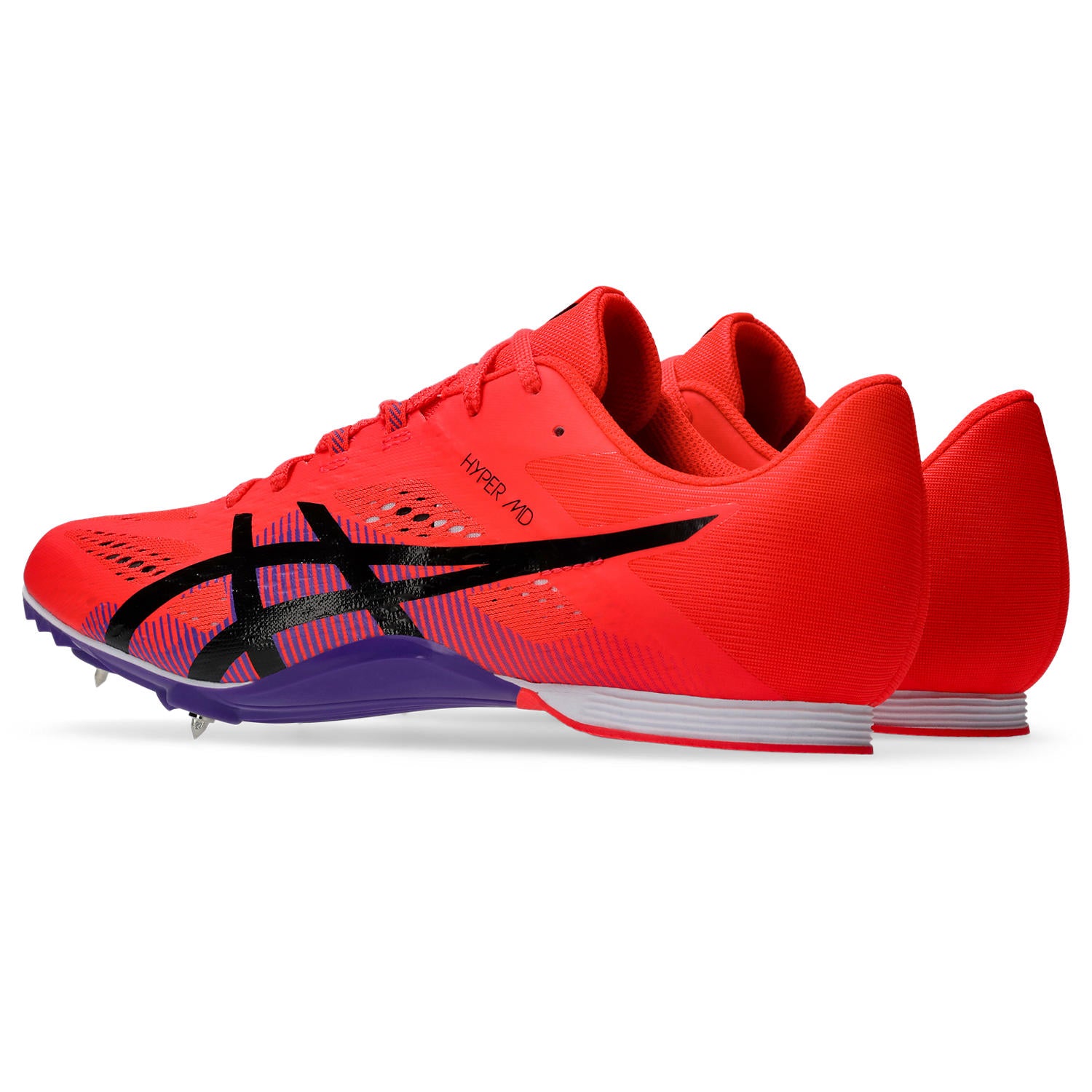 Red running shoes with cleats on a white background