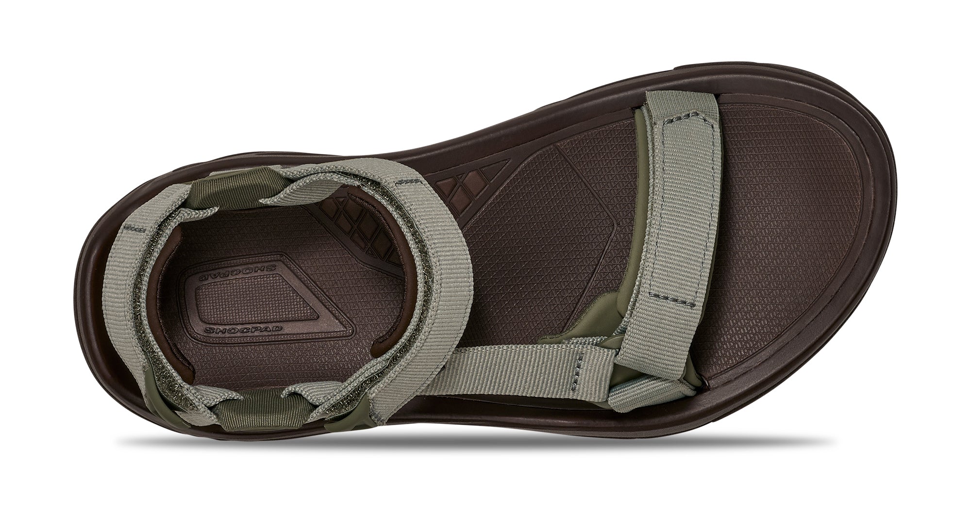 Brown sandal with green straps on a white background