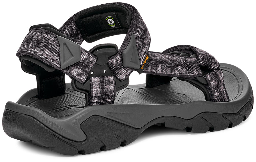 Black and gray sandal with patterned straps on a white background