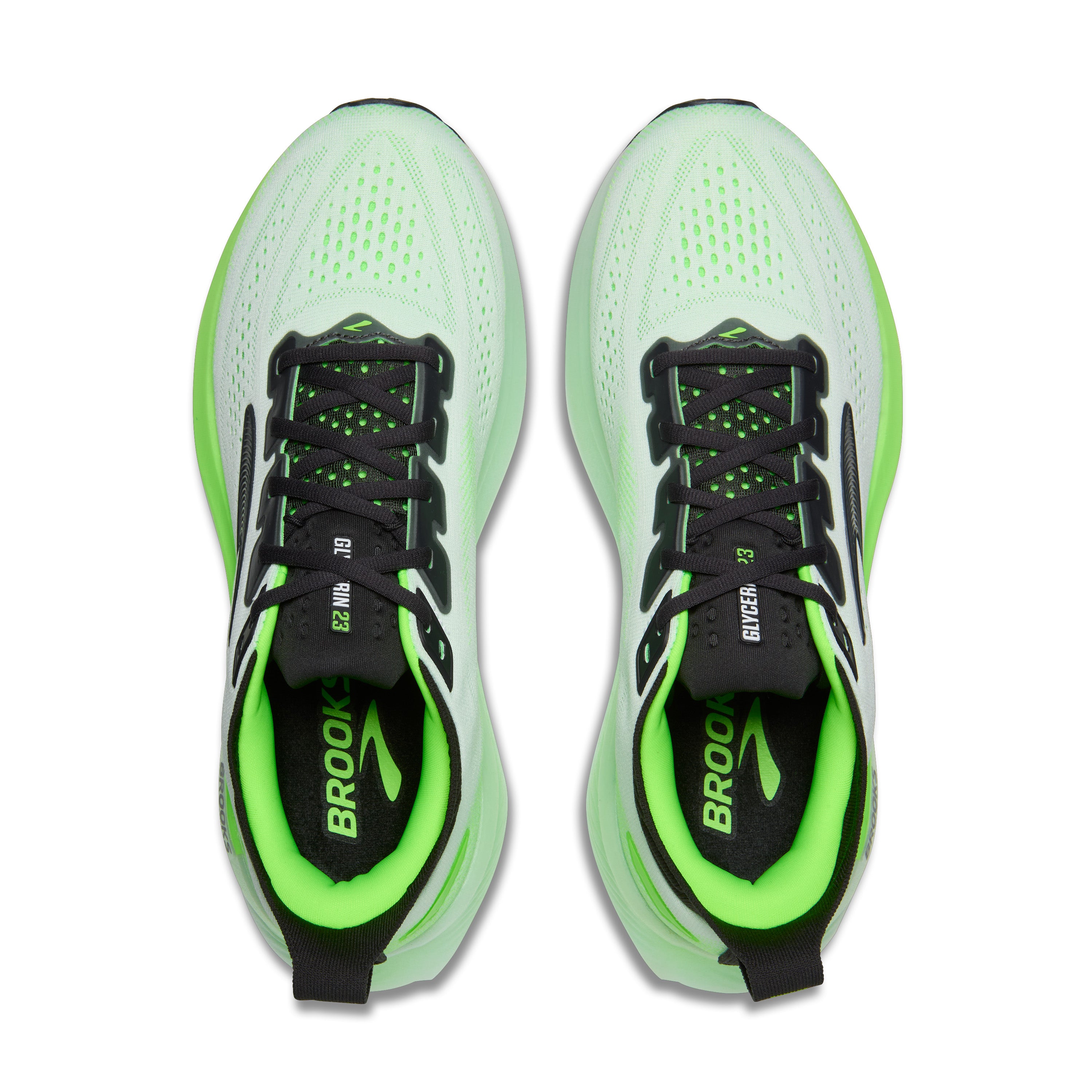 Pair of green and black running shoes with 'Brooks' branding on a white background