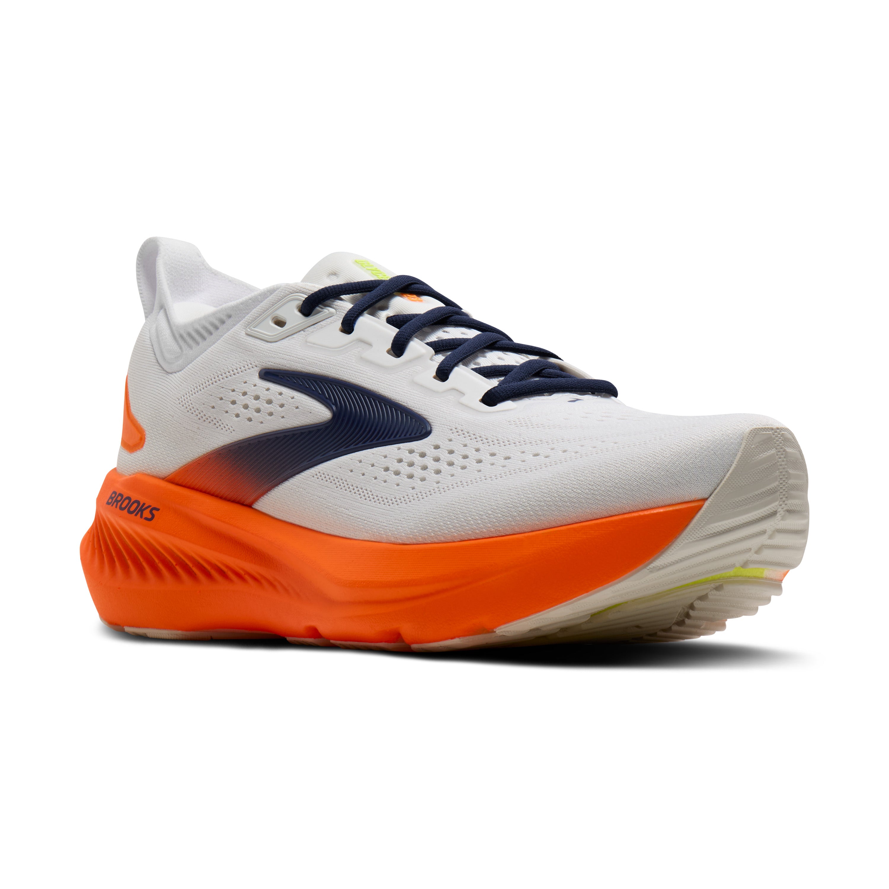 White running shoe with orange sole on a white background