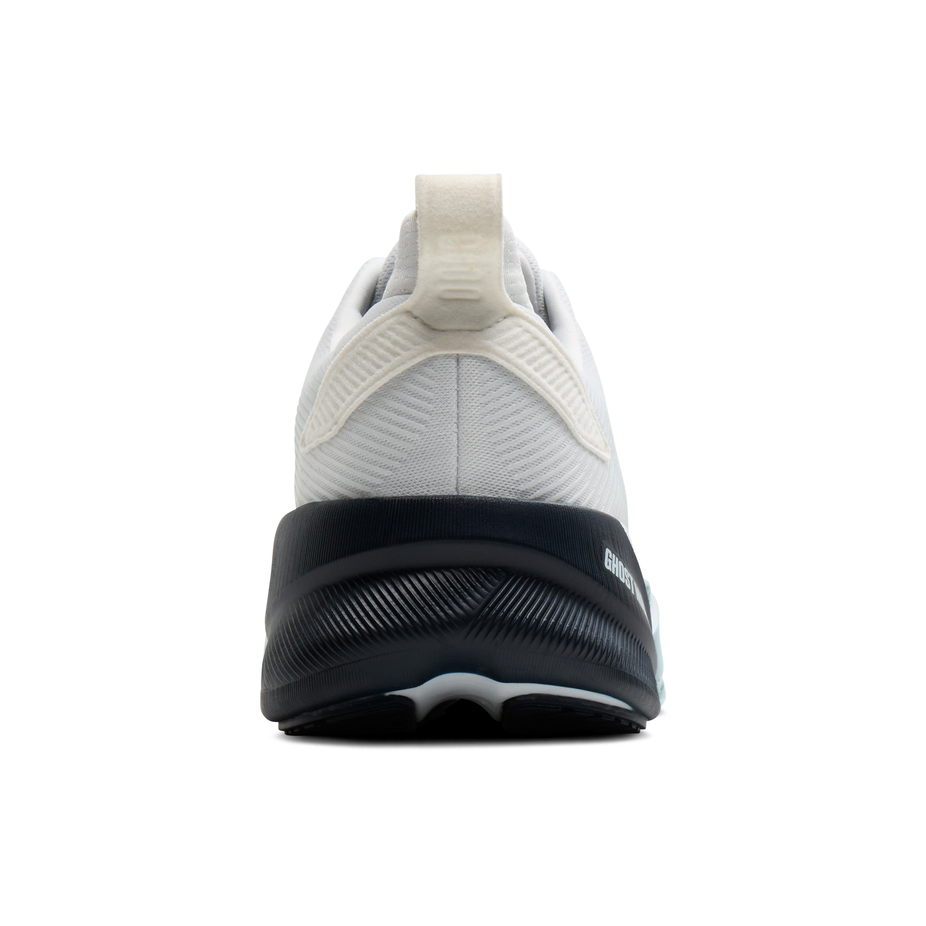 White athletic shoe with black sole on a white background