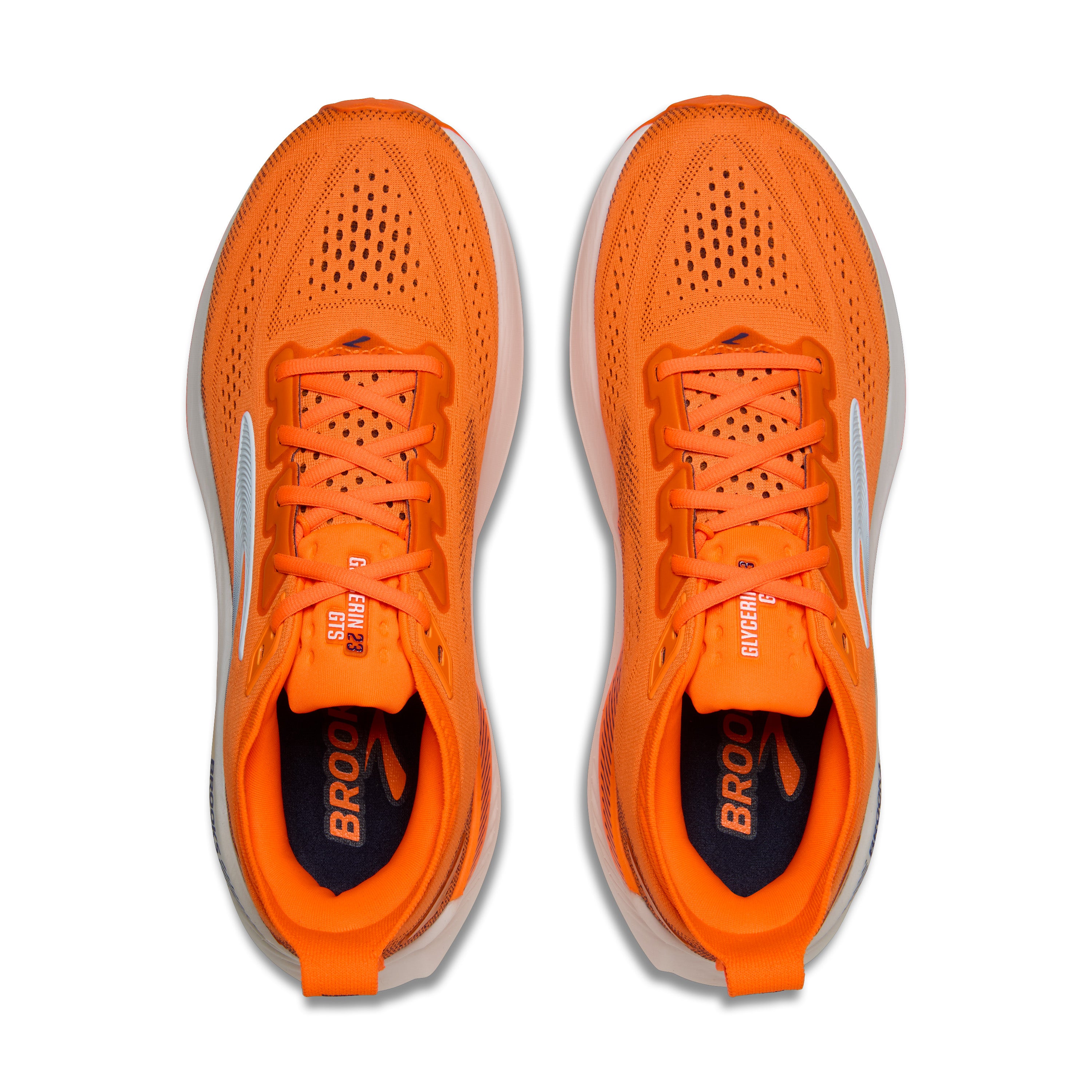 Pair of orange running shoes with 'Brooks' branding on a white background