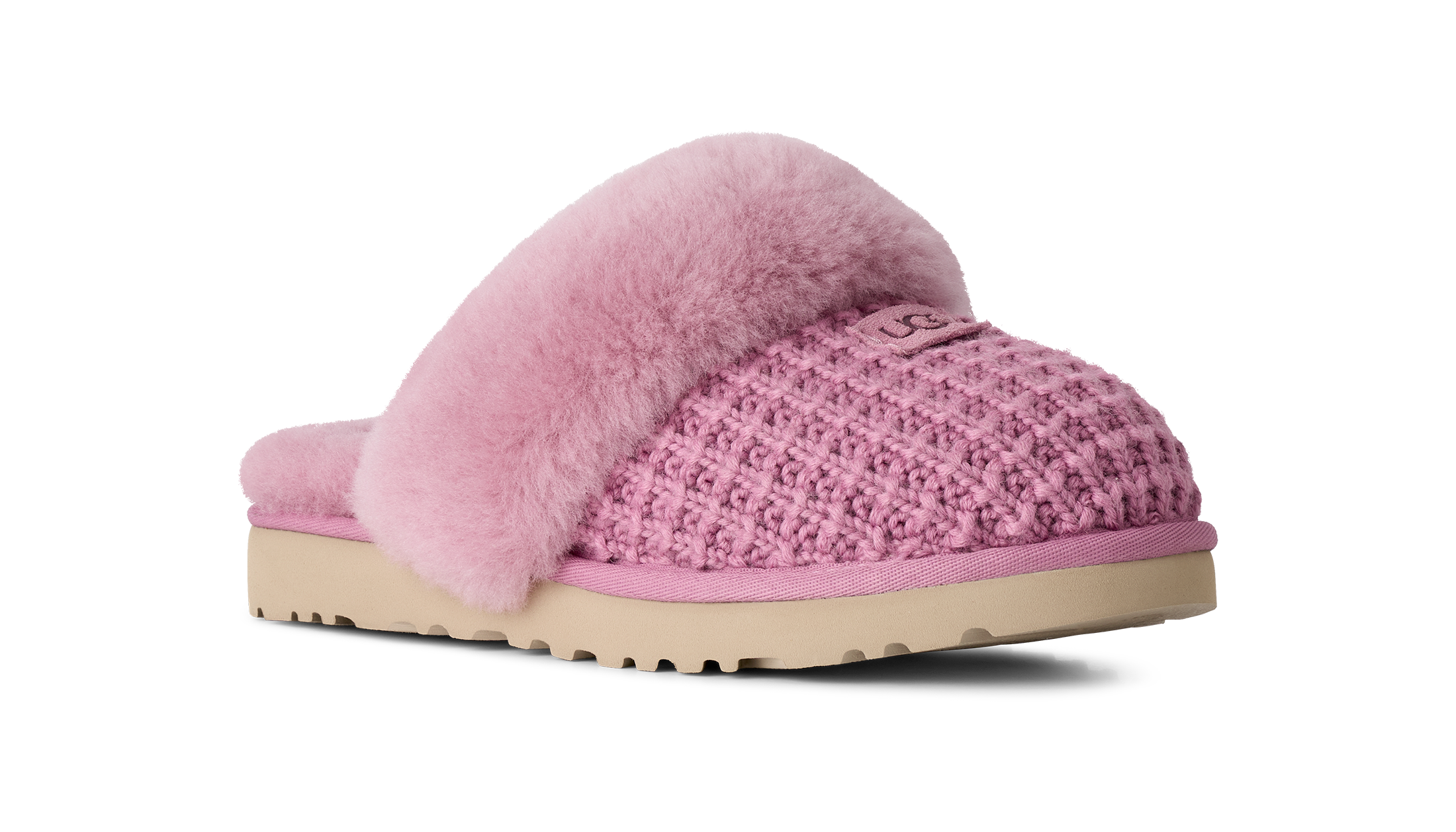 A pink knit slipper with fluffy pink faux-fur trim and a beige sole, shown from a side profile on a white background.