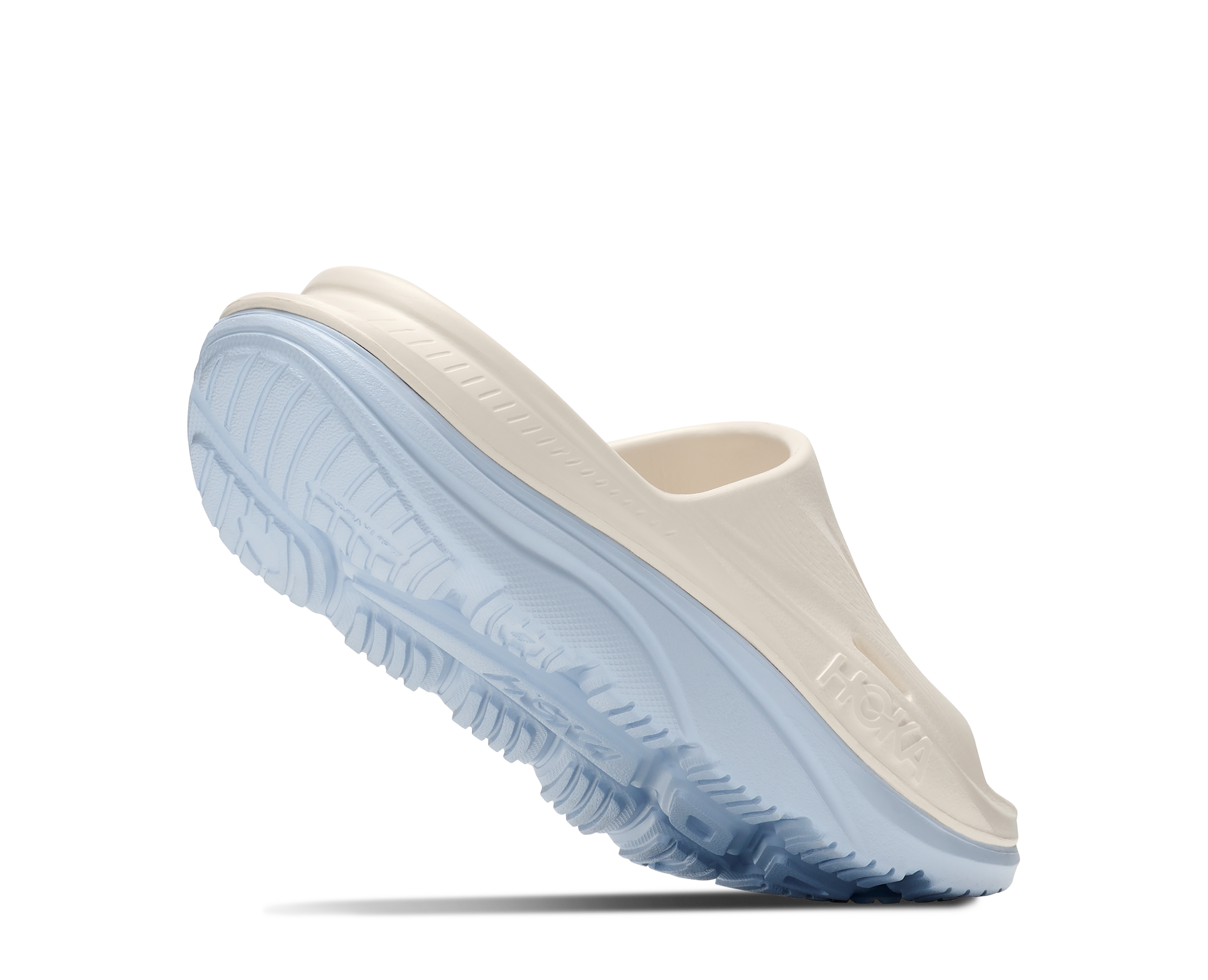Light blue and beige shoe on a white background