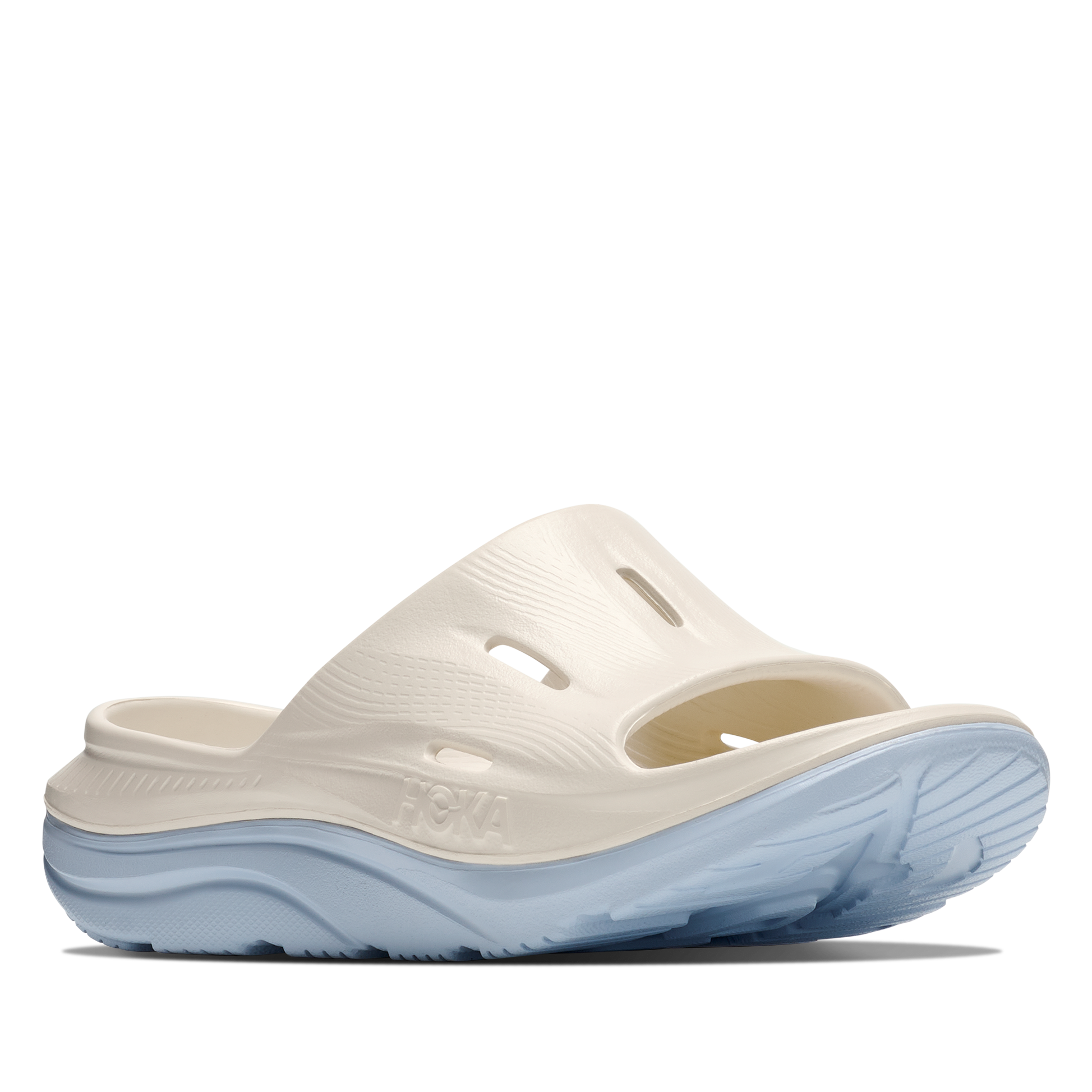 White sandal with blue sole on a white background