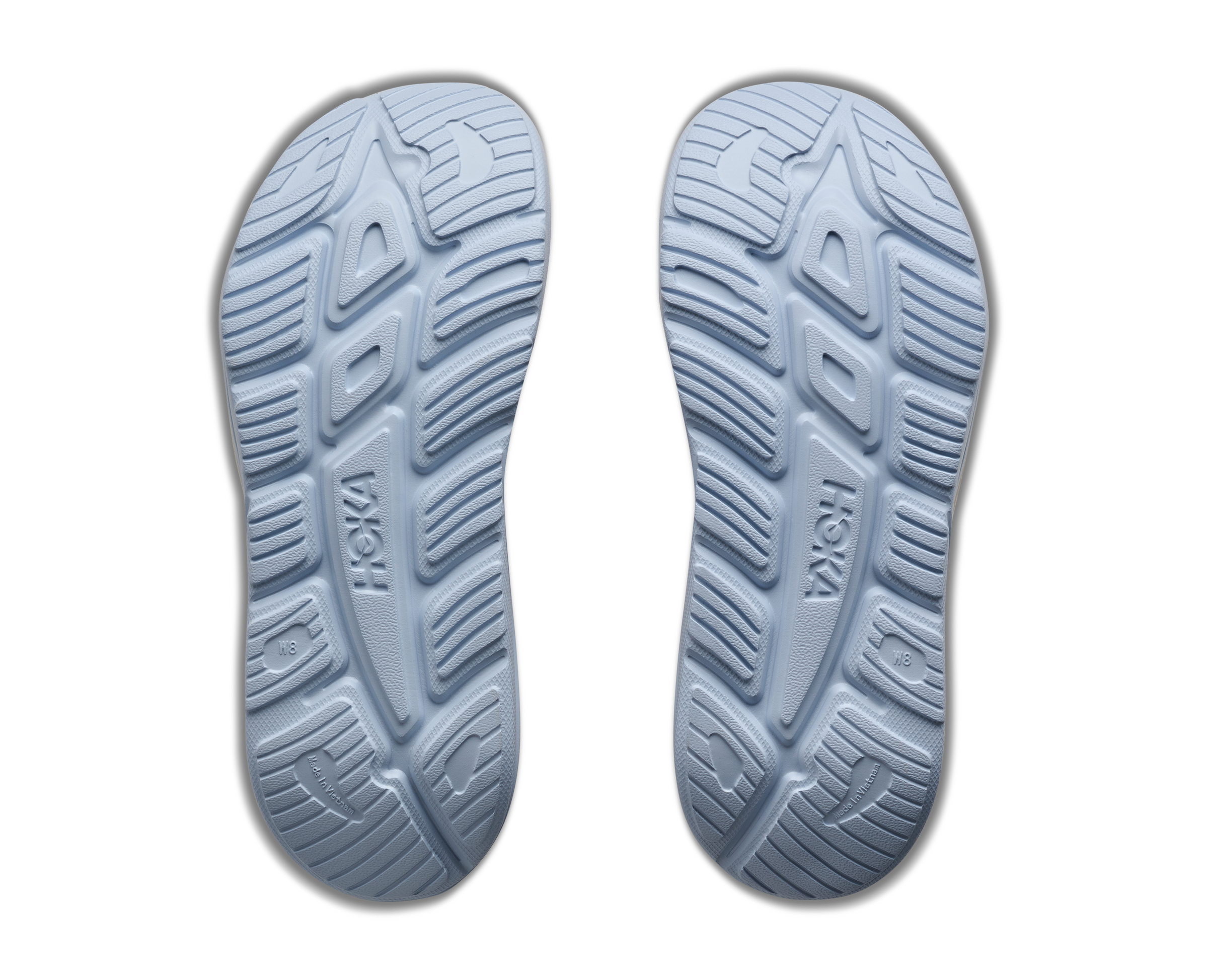 Hoka brand shoe soles on a white background