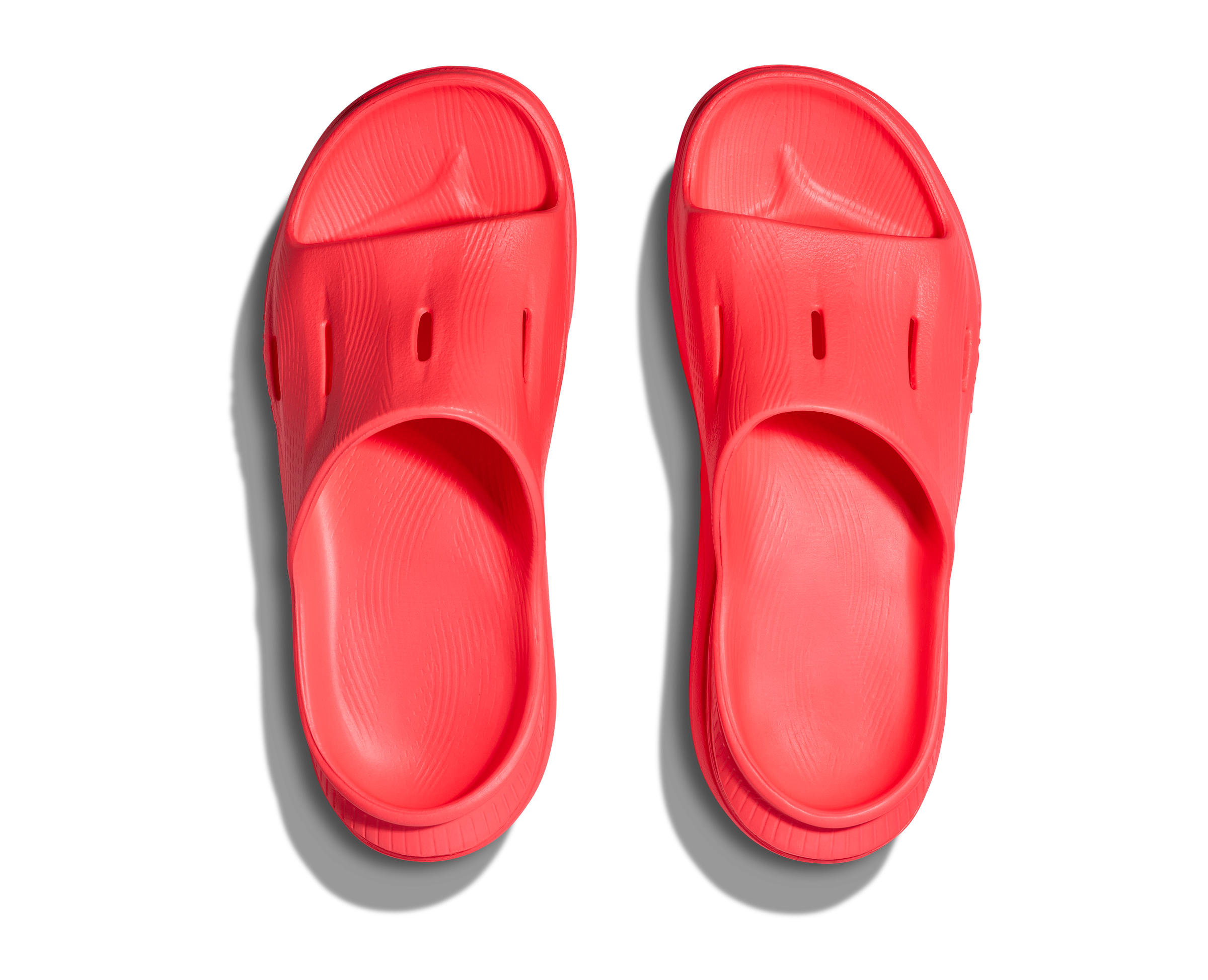 Pair of red slides on a white background
