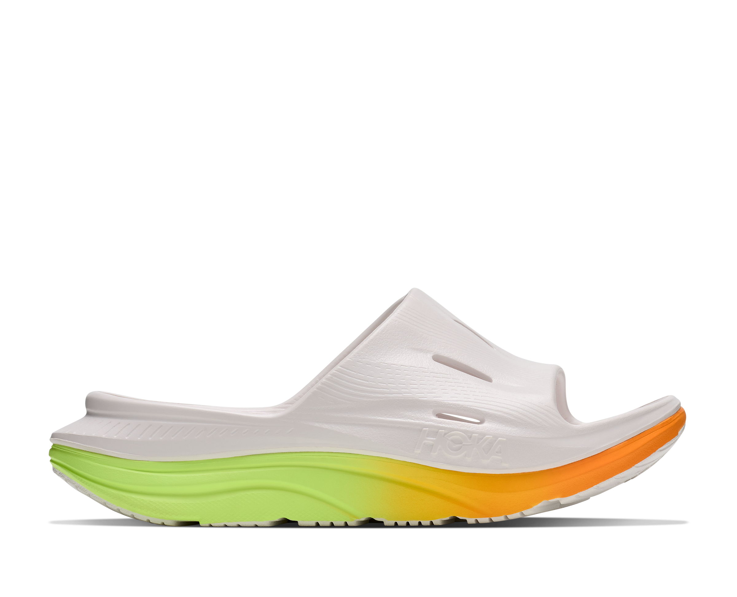White sandal with a colorful sole on a white background