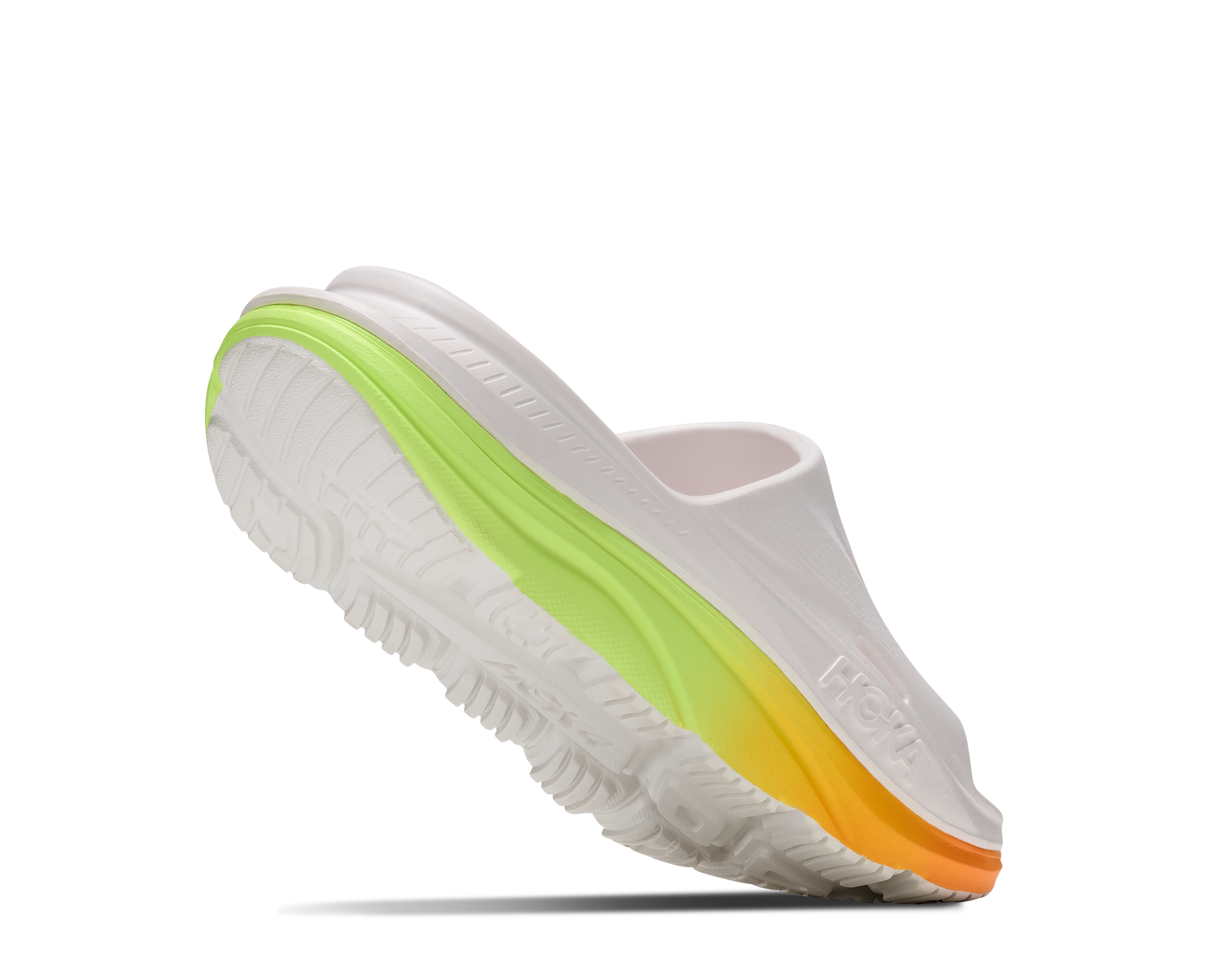 White shoe with a colorful sole on a white background