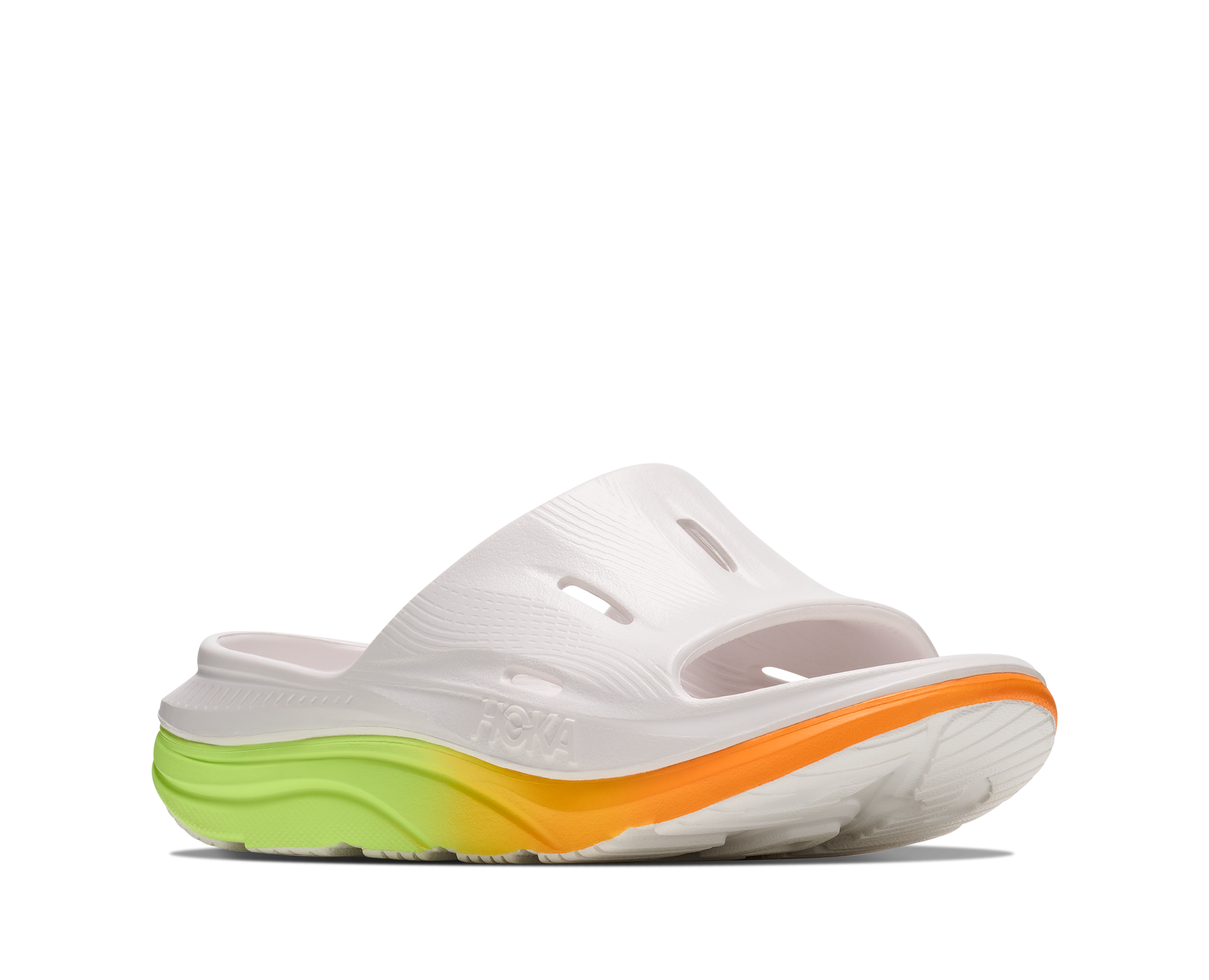 White sandal with a colorful sole on a white background