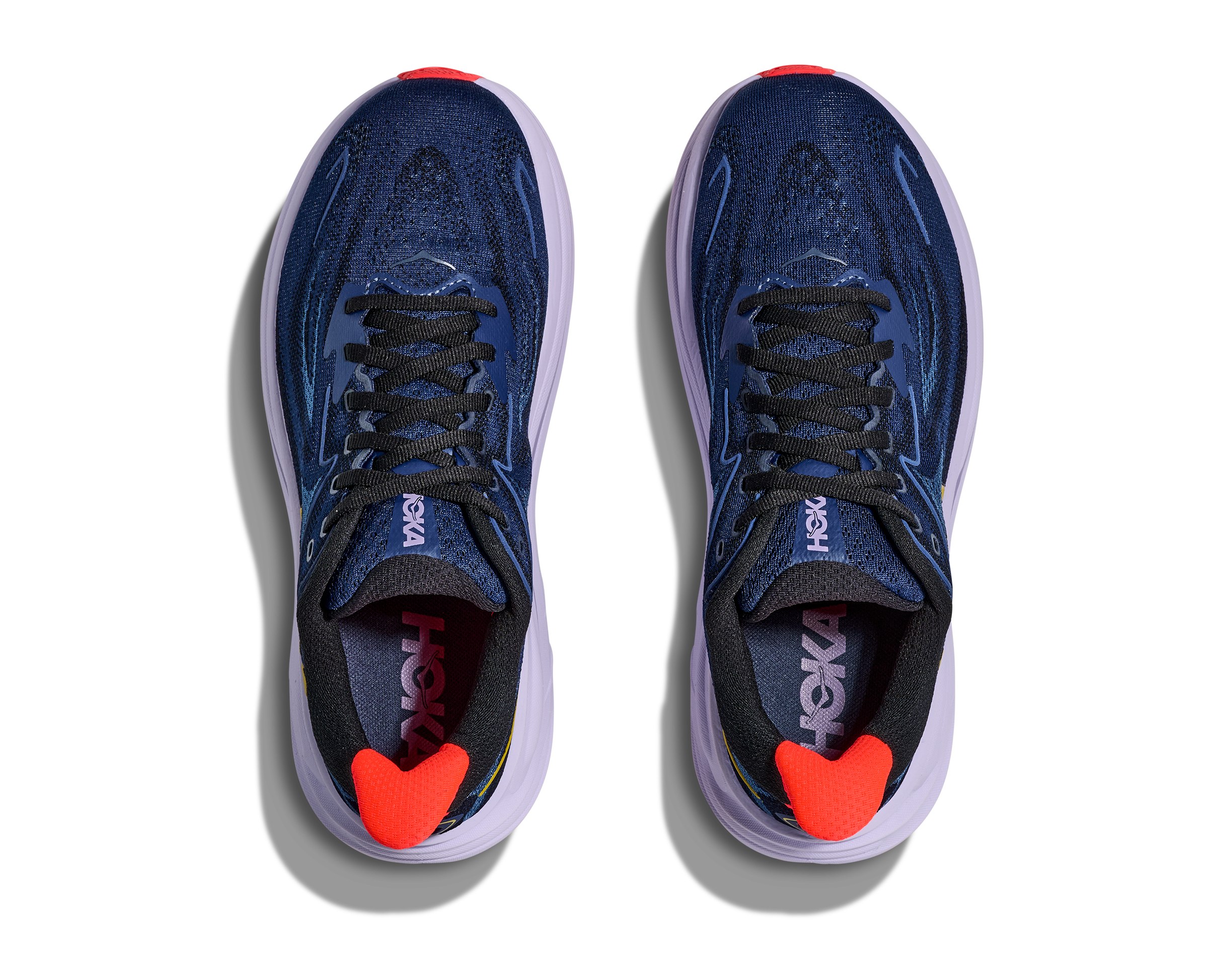 Blue running shoes with red heart details on a white background