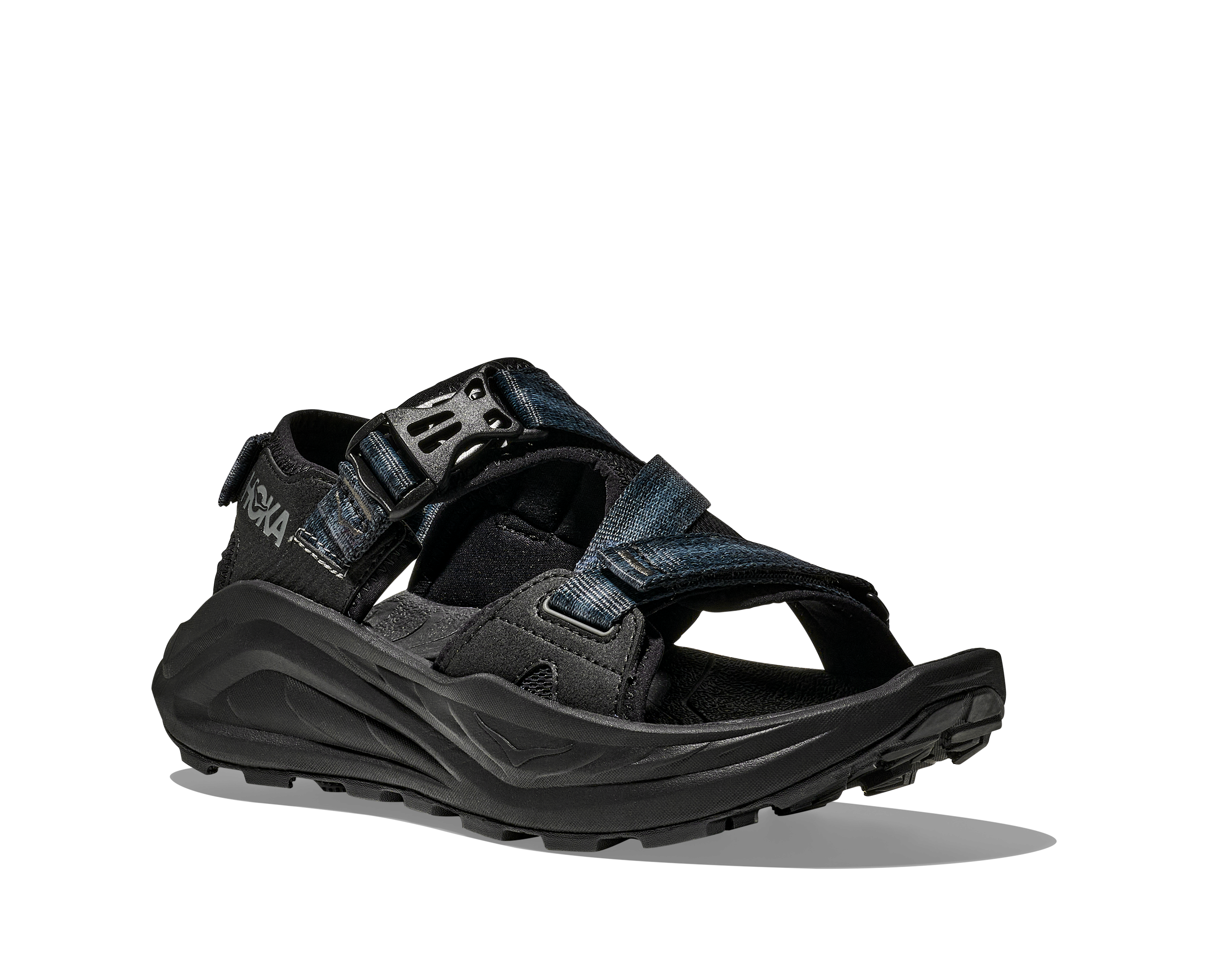 Black sandal with multiple straps on a white background