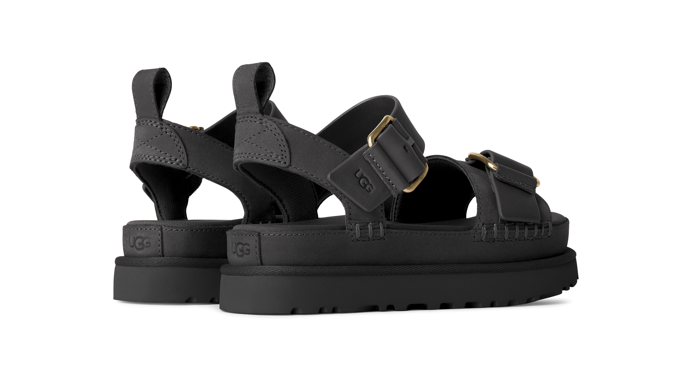 Black sandals with thick sole on a white background