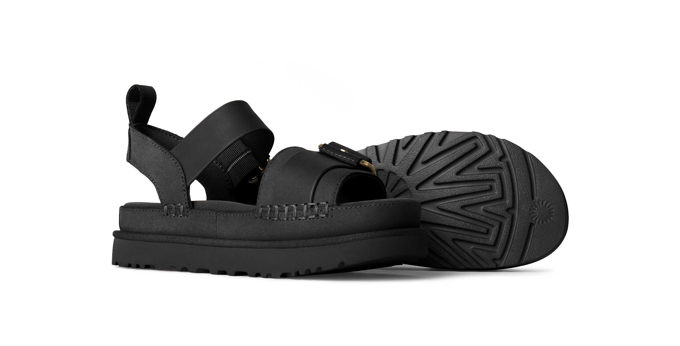 Black sandals with a thick sole on a white background