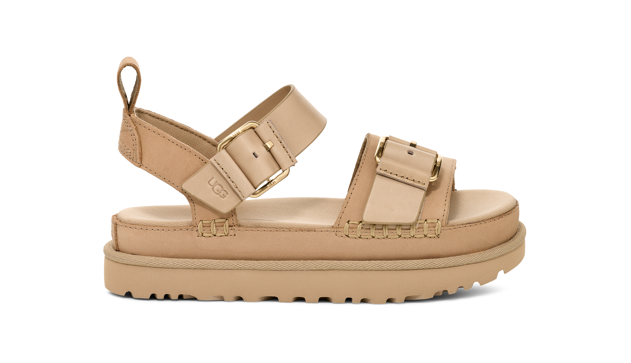 Beige sandal with gold buckles on a white background