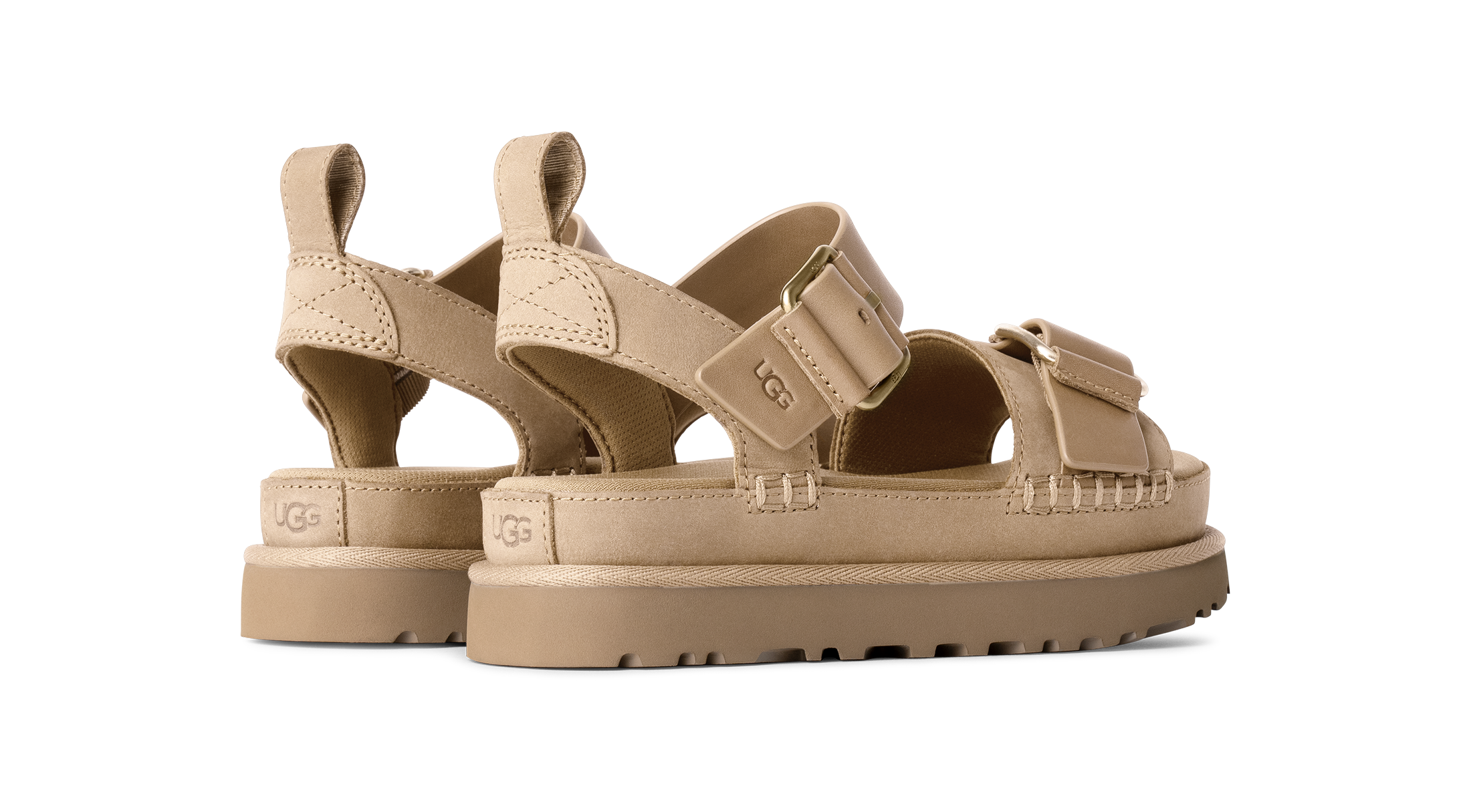 Beige sandals with multiple straps on a white background
