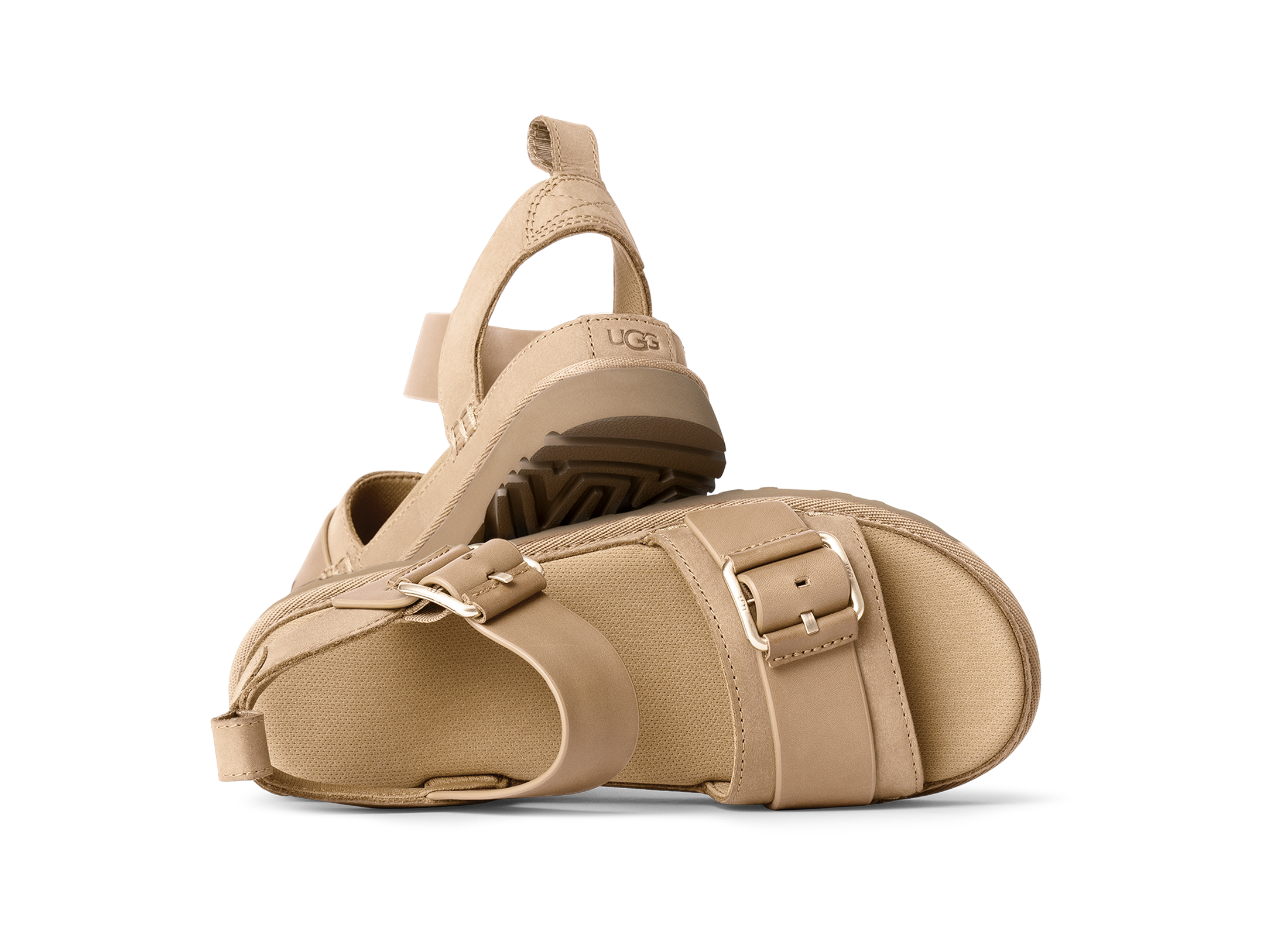 Beige sandals with a strap design on a white background