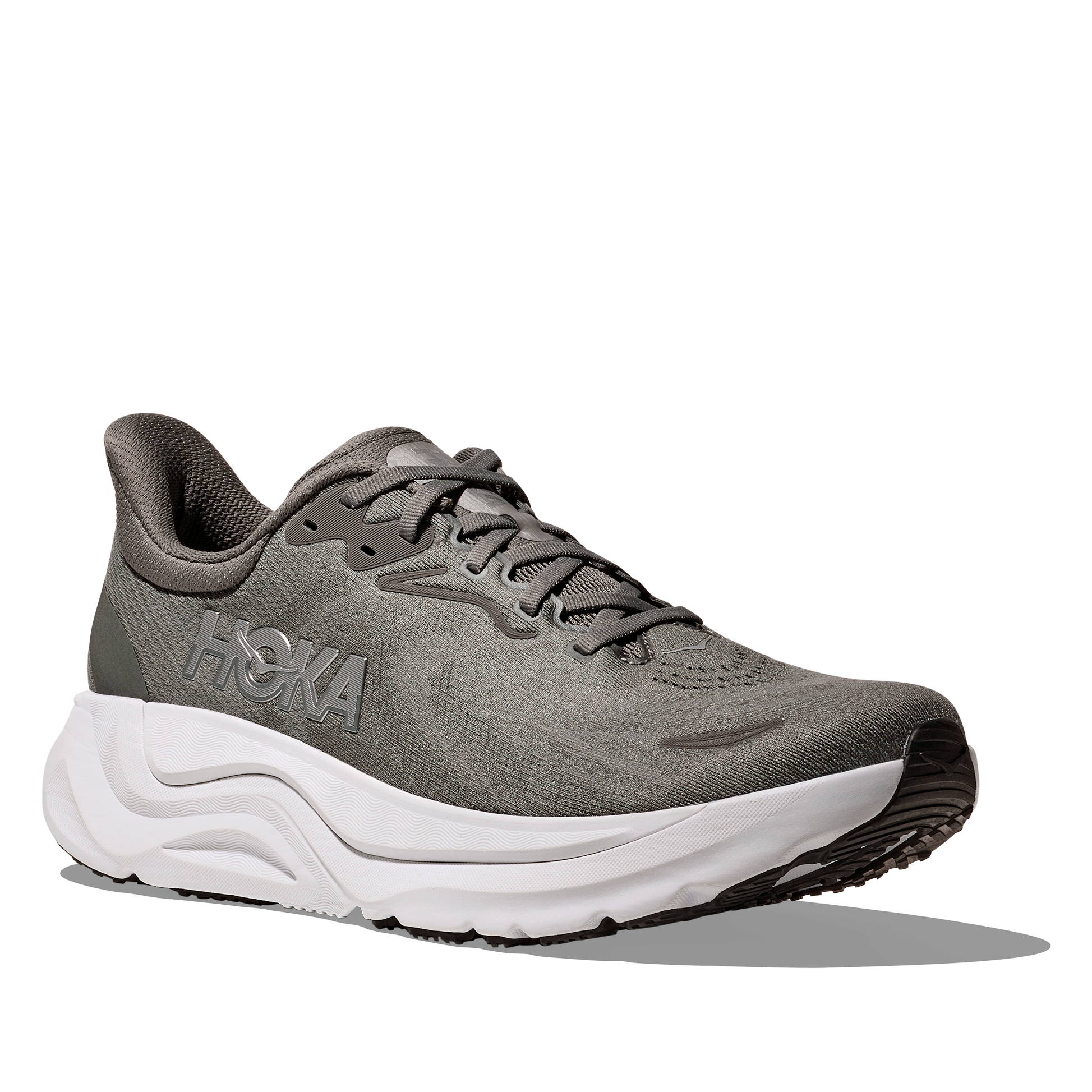 Gray running shoe with white sole on a white background