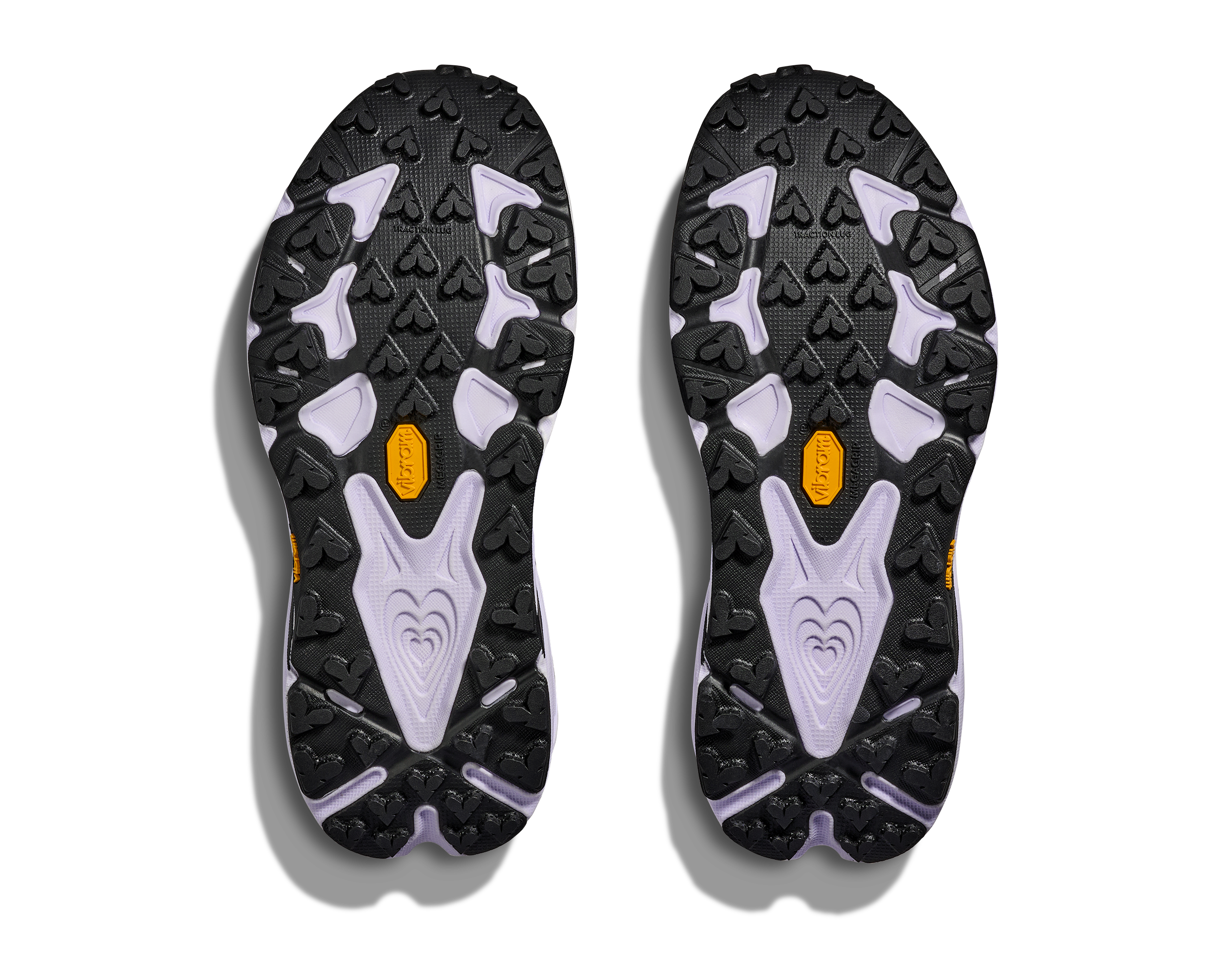 Close-up of black and gray shoe soles with a brand logo on a white background