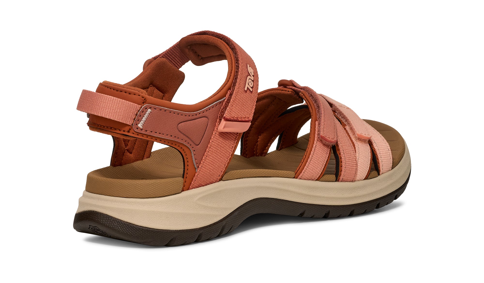 Pair of pink sandals with brown sole on a white background