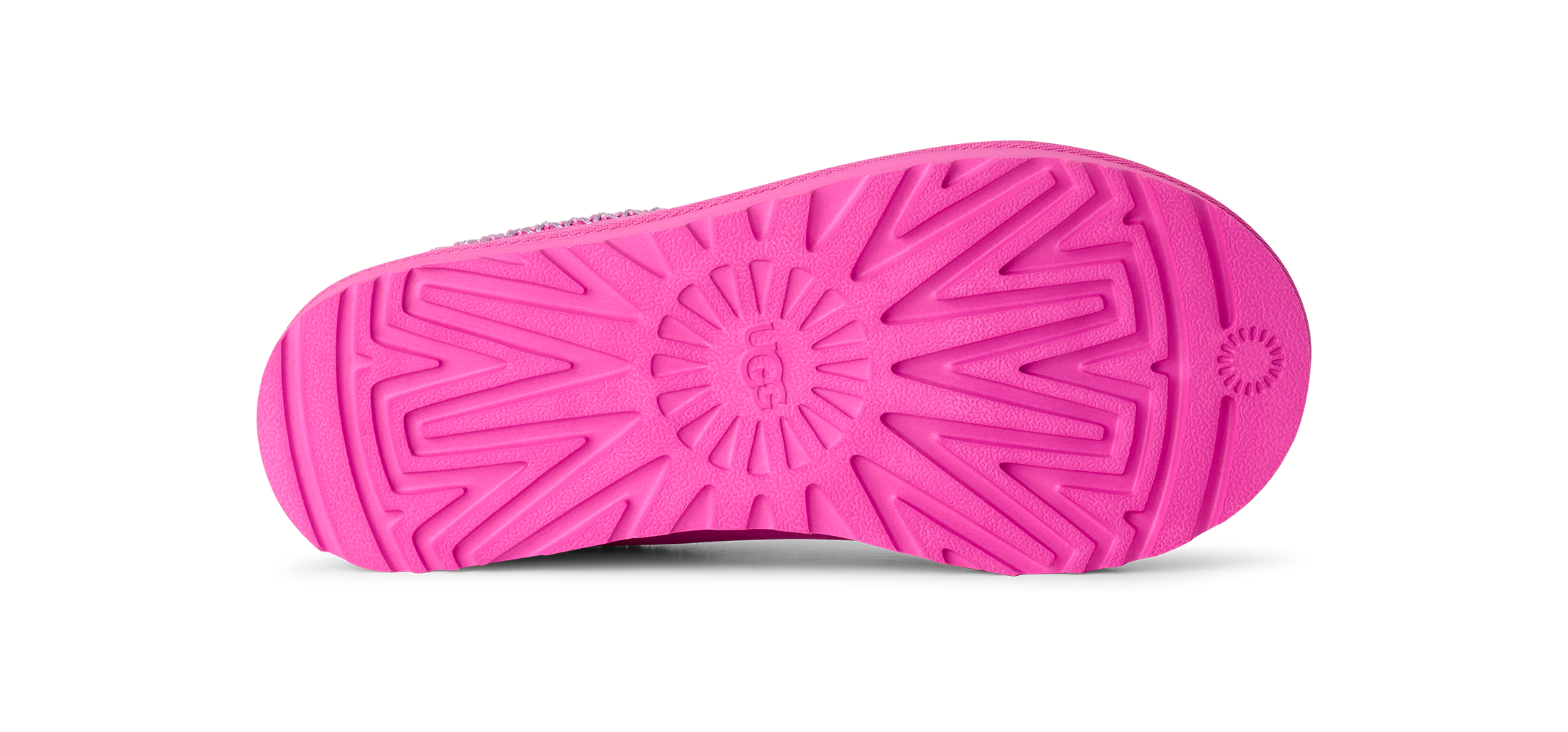 Bright pink shoe sole with a textured radial tread pattern, shown from the bottom against a white background.