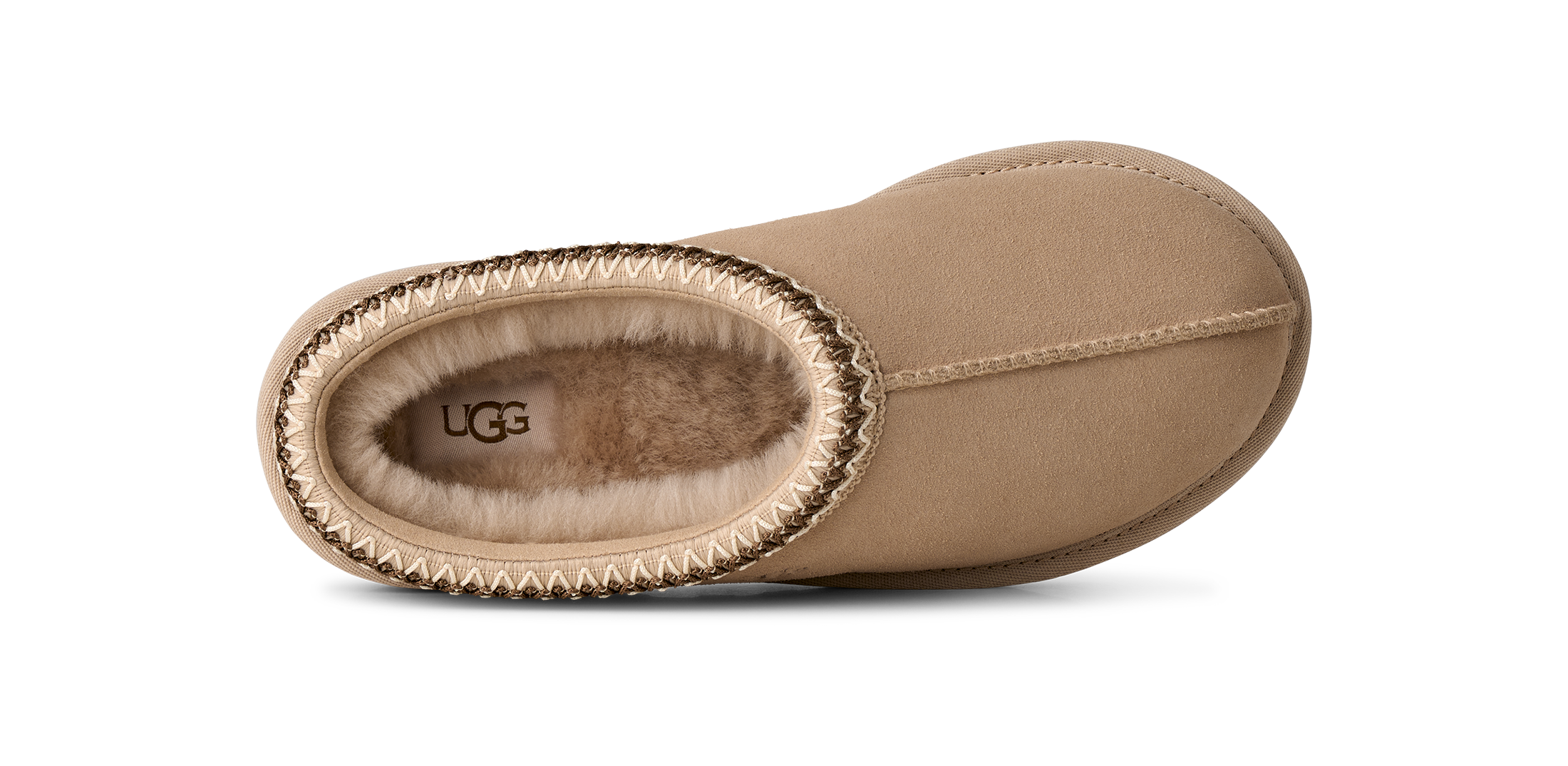 Tan UGG slipper with brand logo on a white background