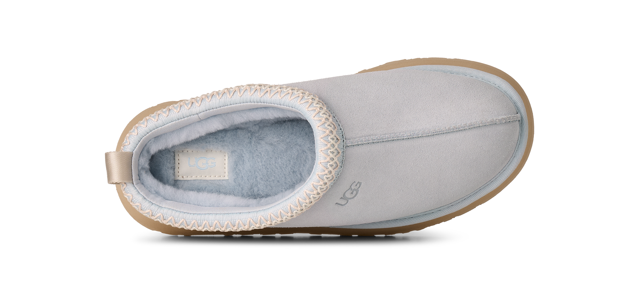 Gray slip-on shoe with brown trim on a white background