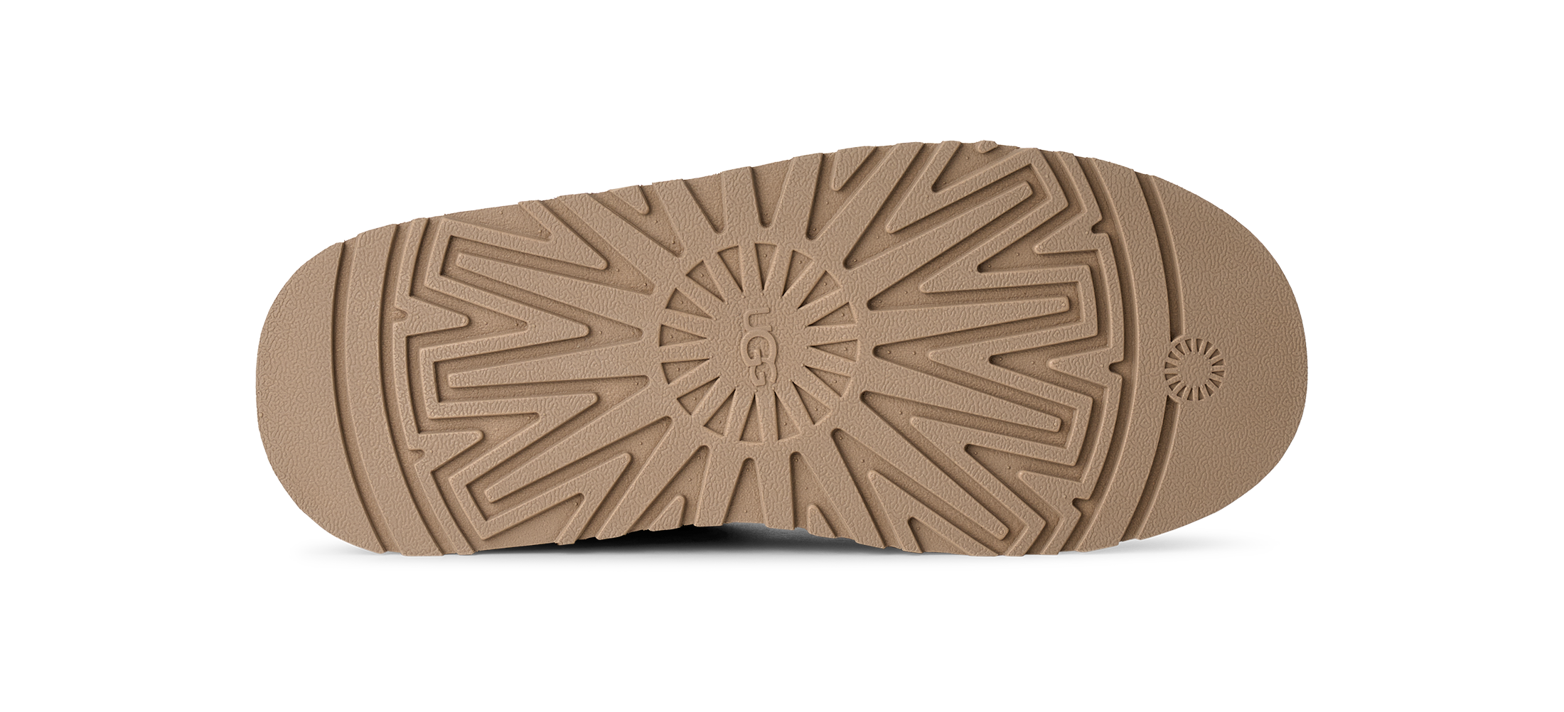 Close-up of a brown shoe sole with tread pattern on a white background