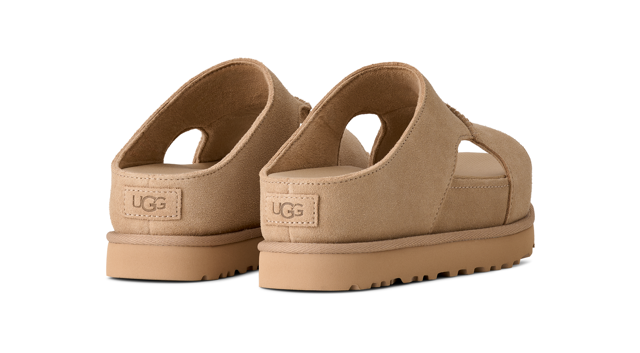 Beige UGG sandals on a white background