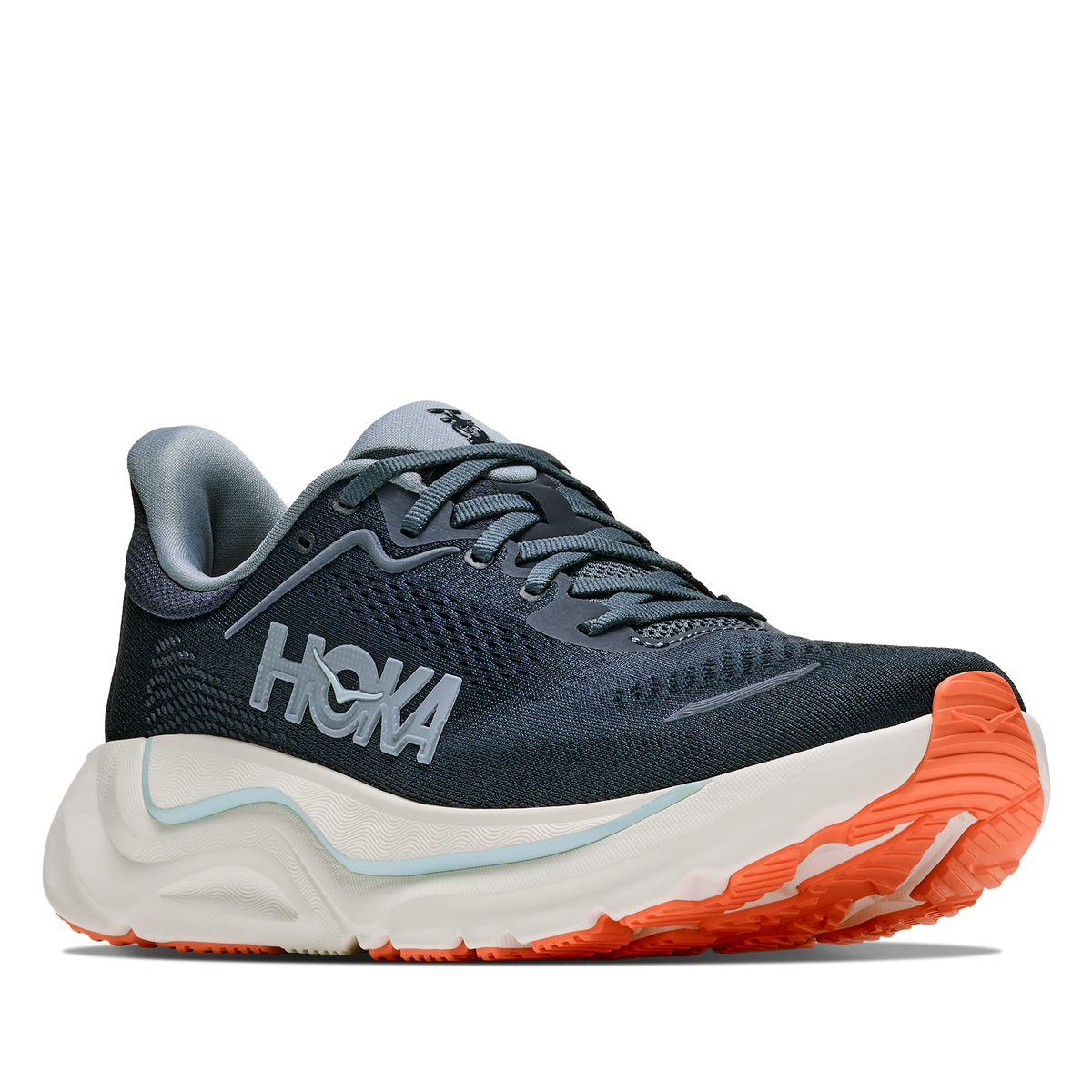 Navy running shoe with orange sole on a white background