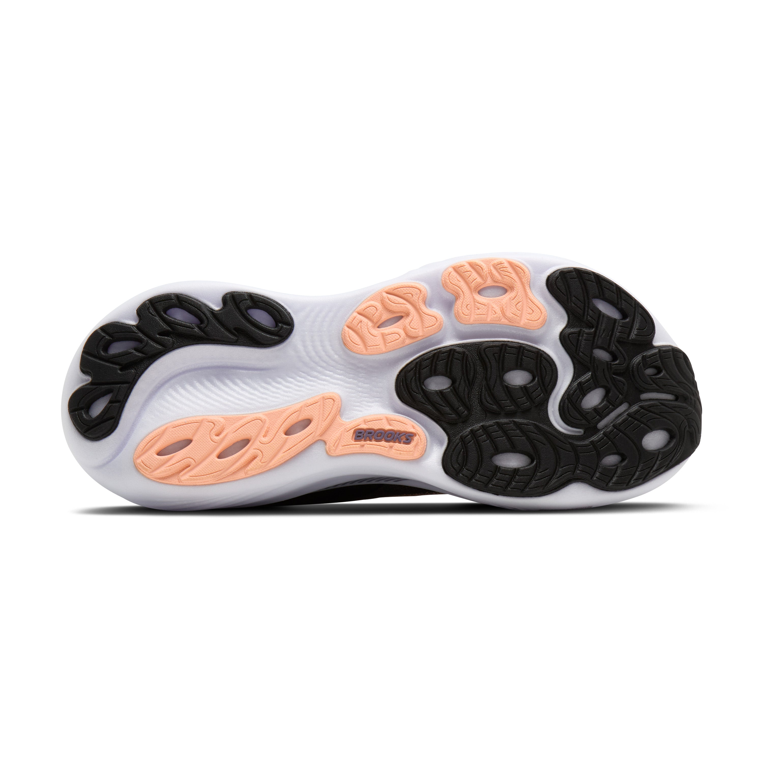 Close-up of a shoe sole with black and orange pattern on a white background