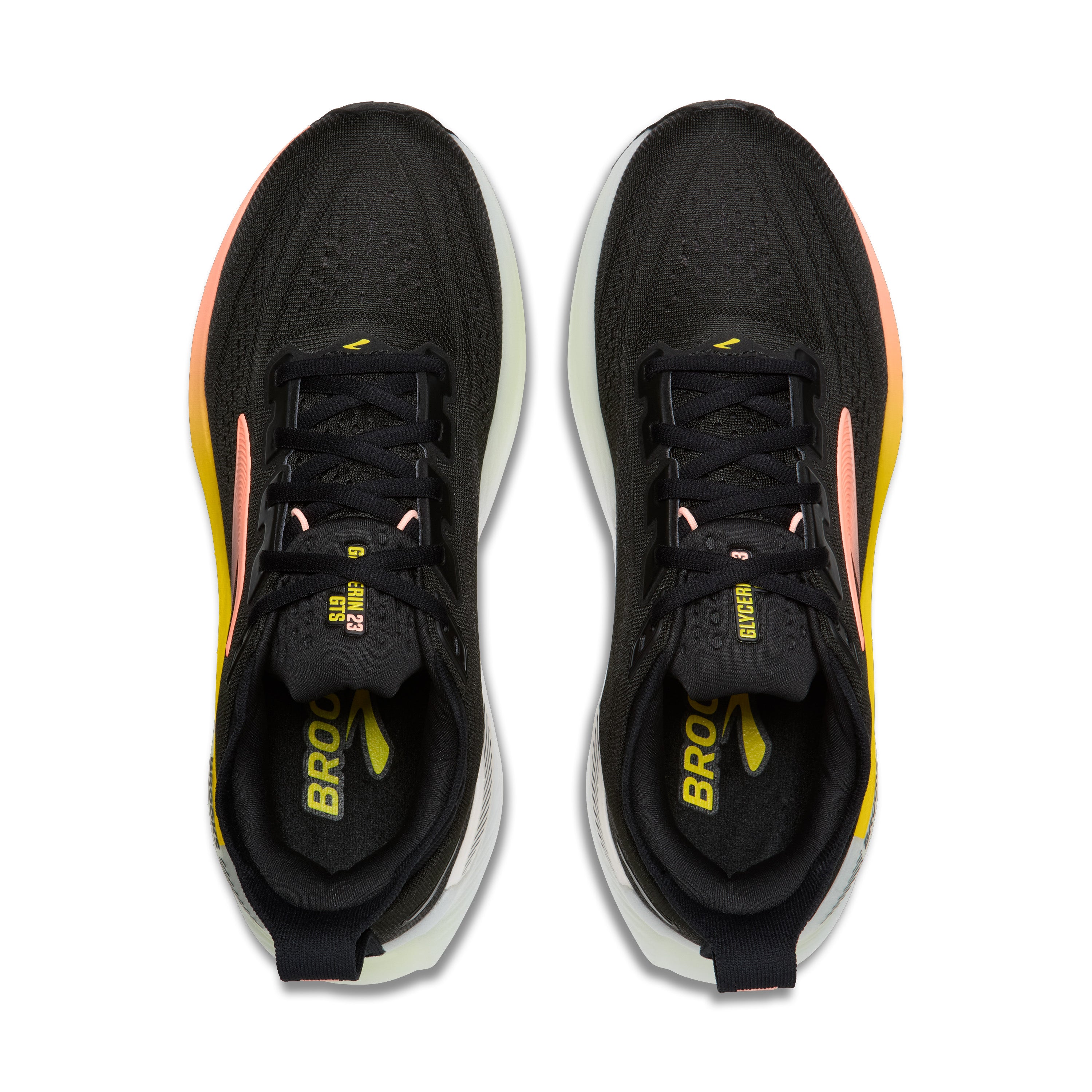 Black running shoes with yellow accents on a white background